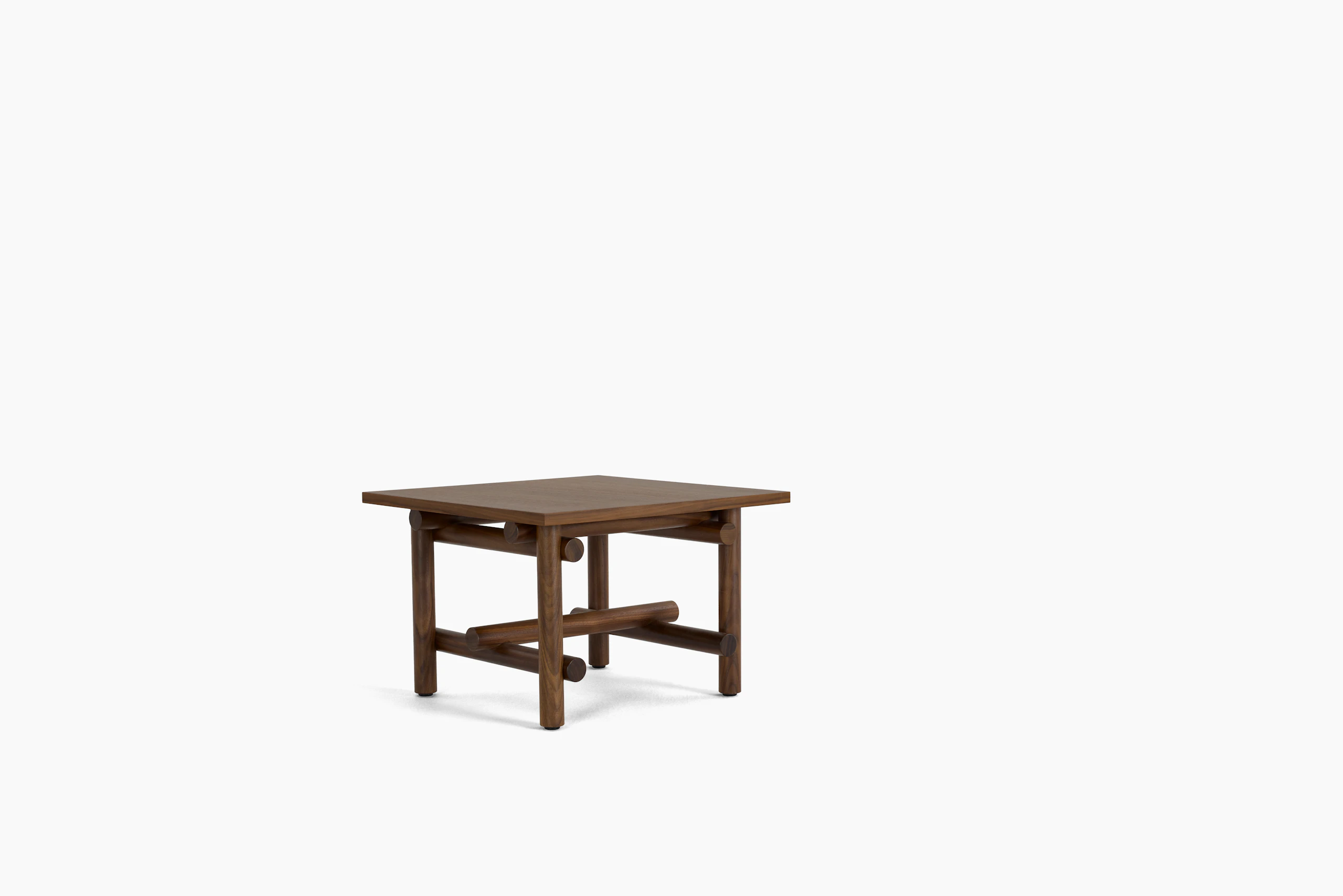 A Muecke Side Table in Walnut viewed from an angle.