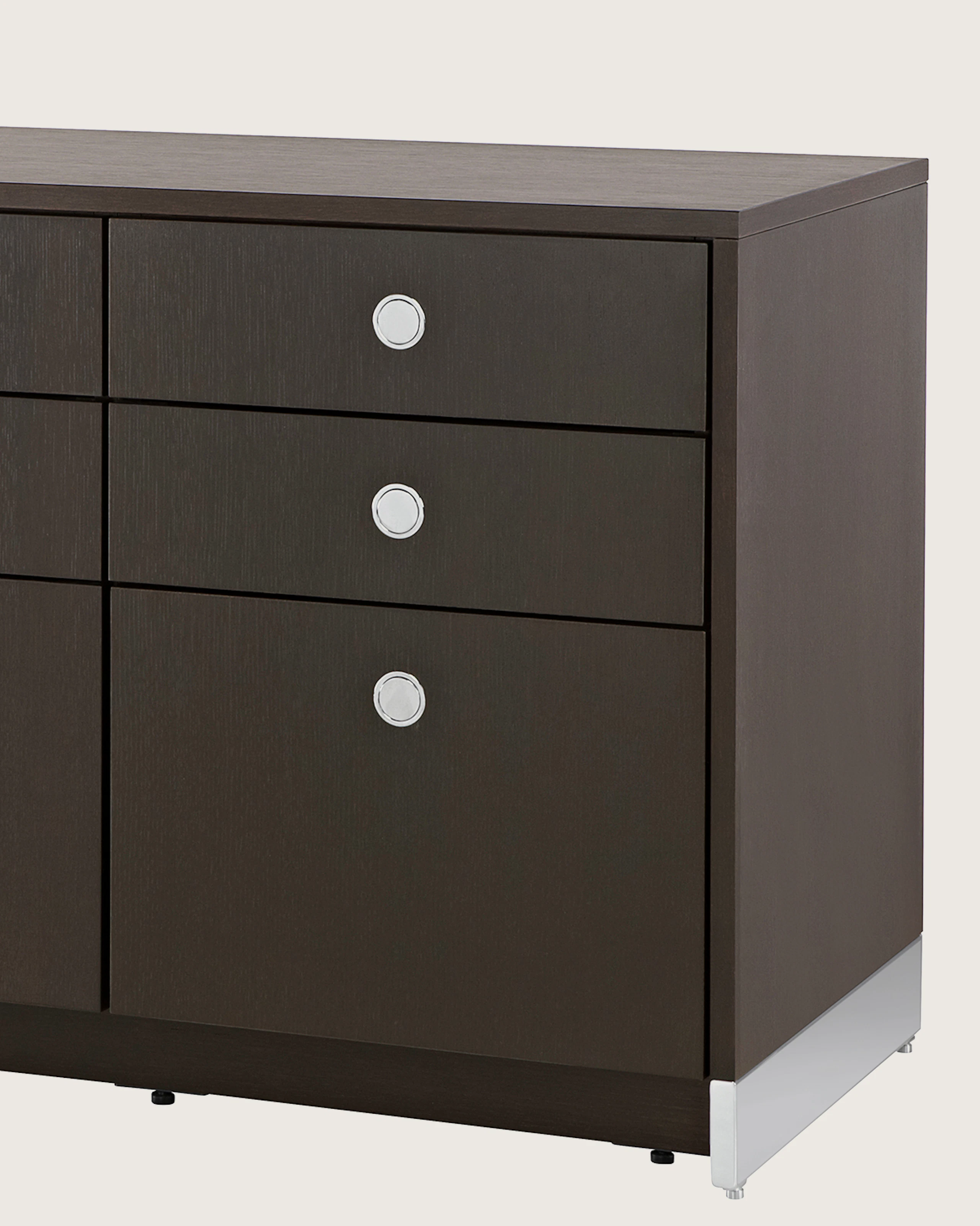 Angled view of a Sled Base Storage unit with a dark wood finish, showing the chrome base.