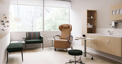 Exam room with casework against the side wall, a recliner, and side seating.