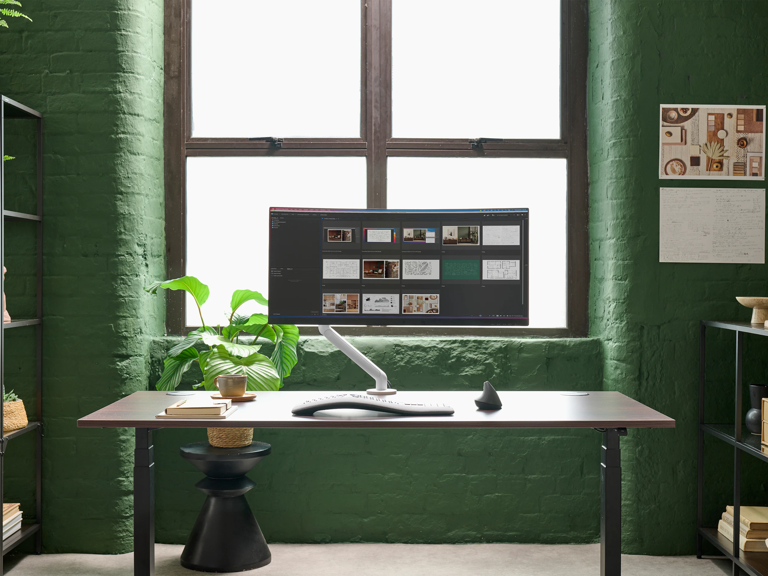 White Flo monitor arm viewed from front in a working environment.