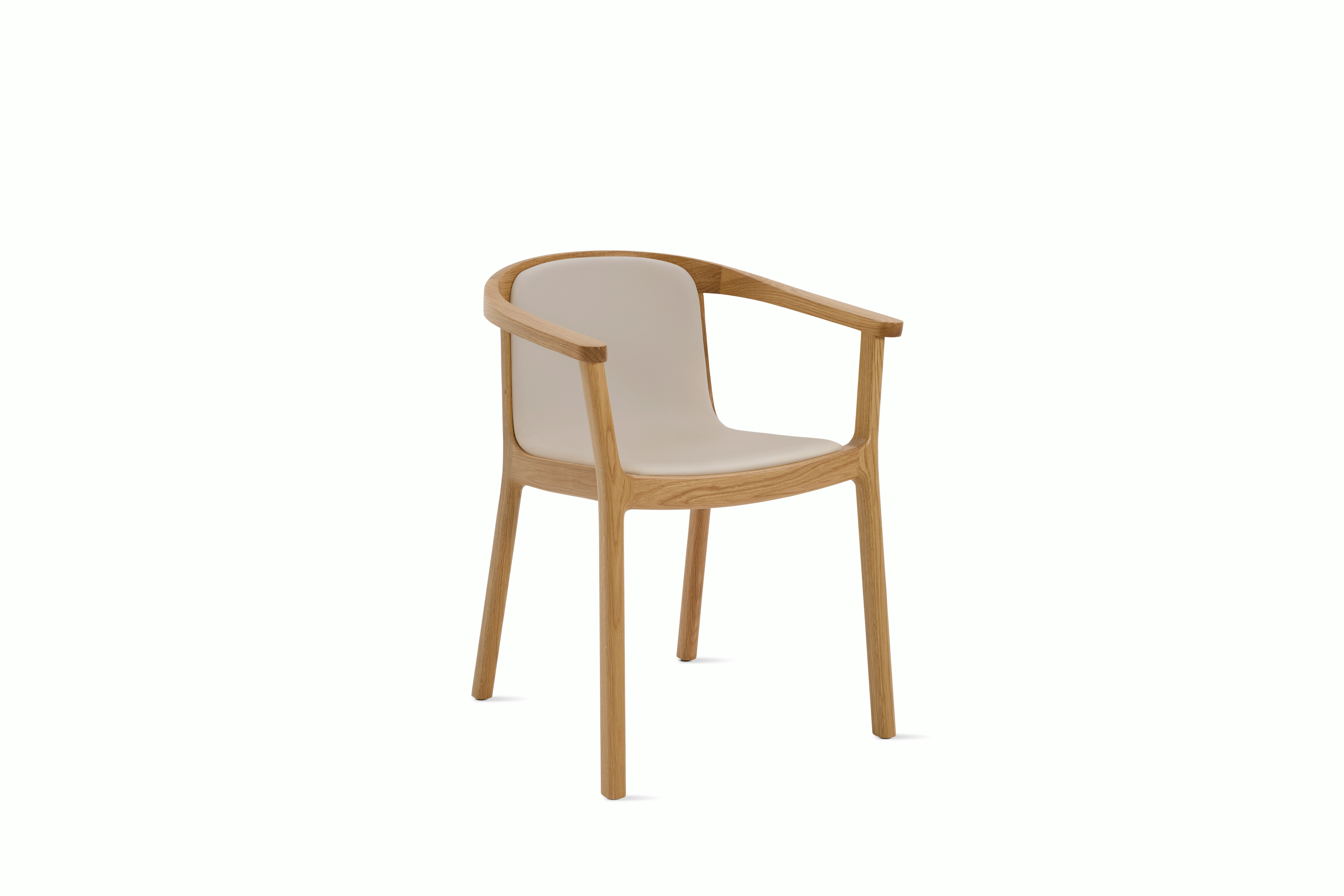 A Lijn Armchair in Timbre Oak viewed from an angle.