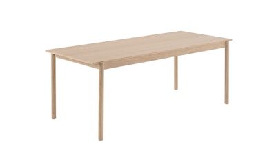 A three-quarter angled view of a Linear System Table by Muuto