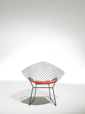 Harry Bertoia Diamond Chair in black with red seat pad