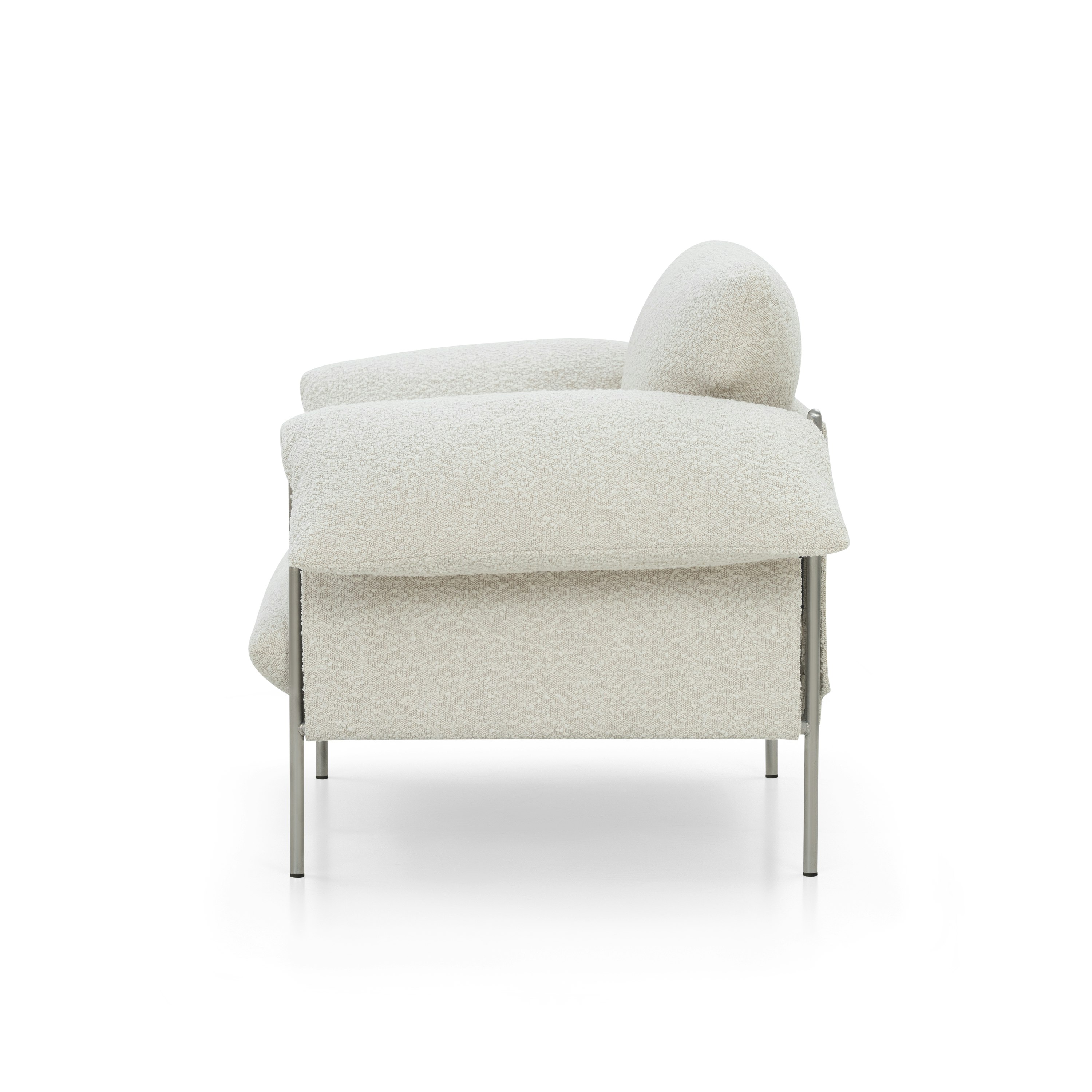 A Alva Chair in La Creme with a Brushed Steel finish viewed from the side