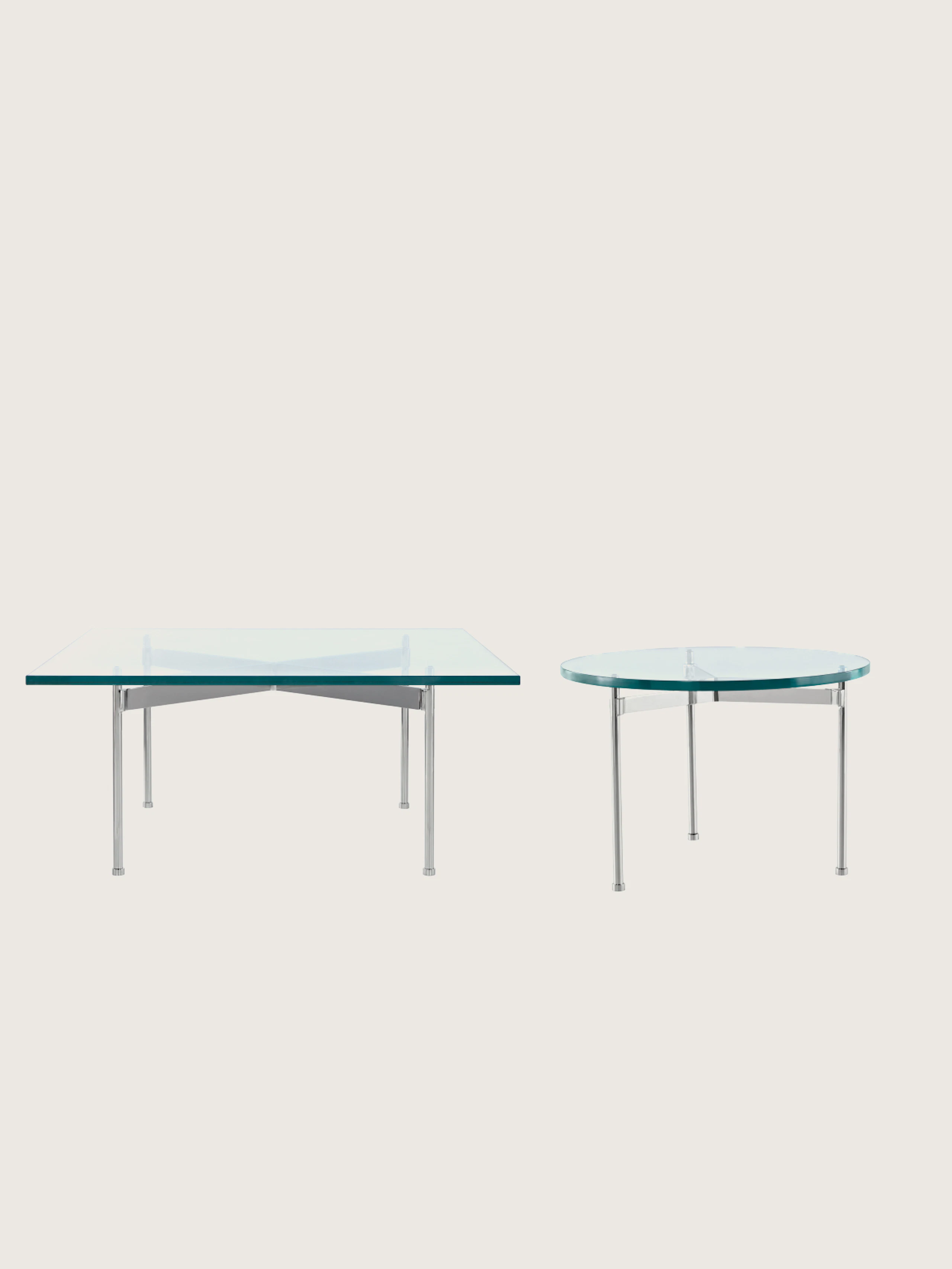 Two Claw Tables designed by Ward Bennett with glass tops and chrome bases, one square version front-facing, and one round version shown at an angle, on a white sweep.