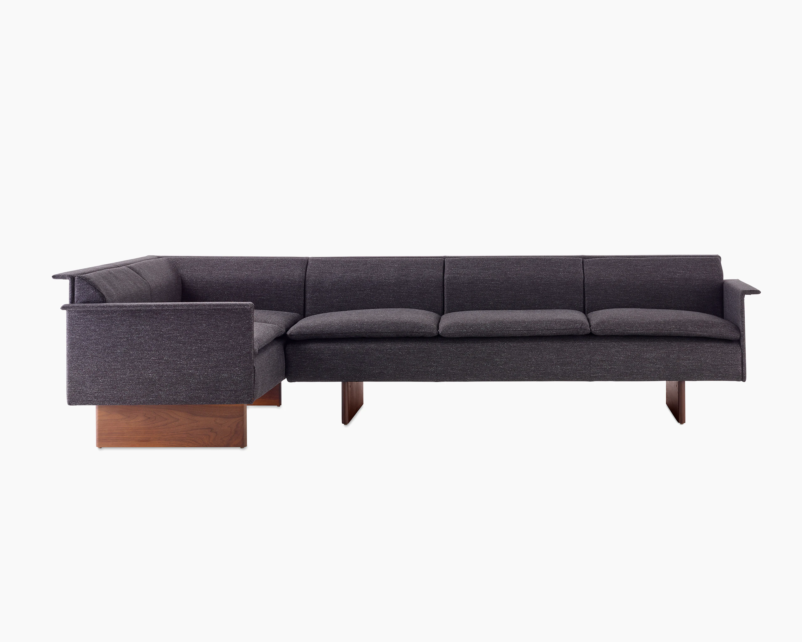 Mantle Sectional Sofa in Bellano Umber with a Walnut Base, viewed from the front.