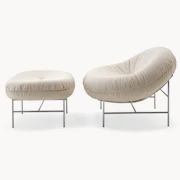 Beige lounge chair and ottoman set.