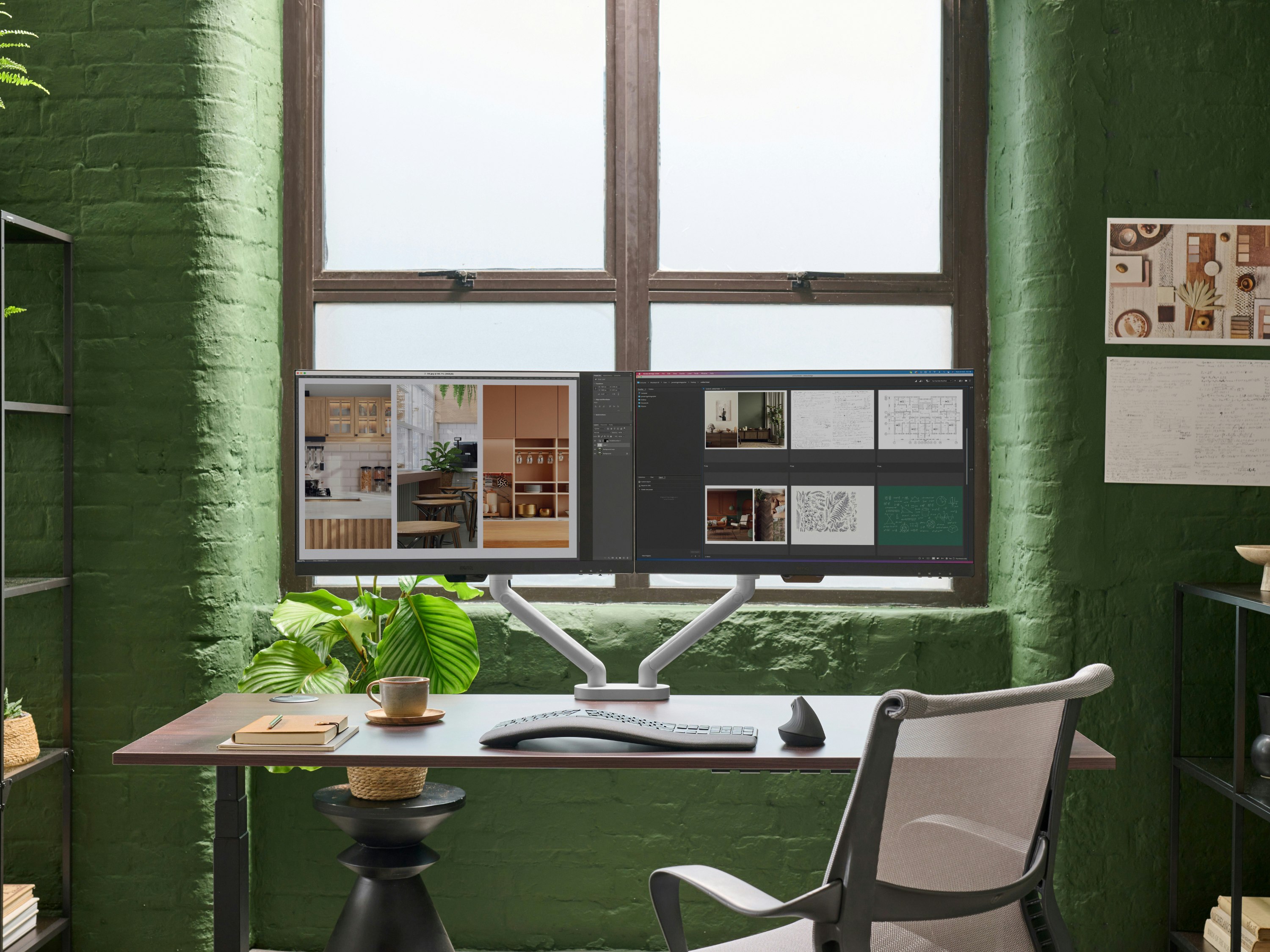 Desk with silver Flo Dual monitor arm in a working environment.