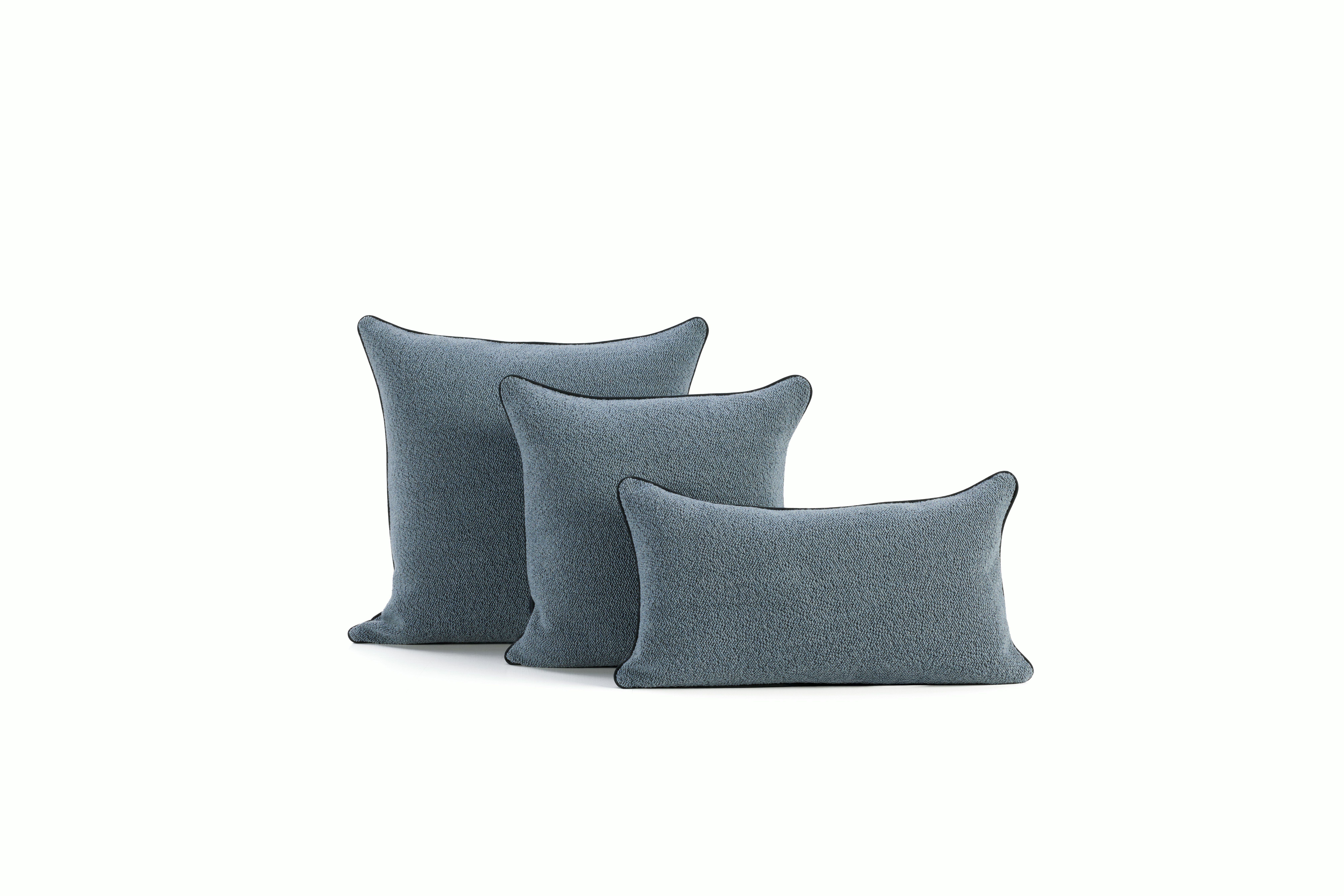 An environmental shot of a Turf Color Blocked Pillow in Blue Grey Dark Blue Family V1.