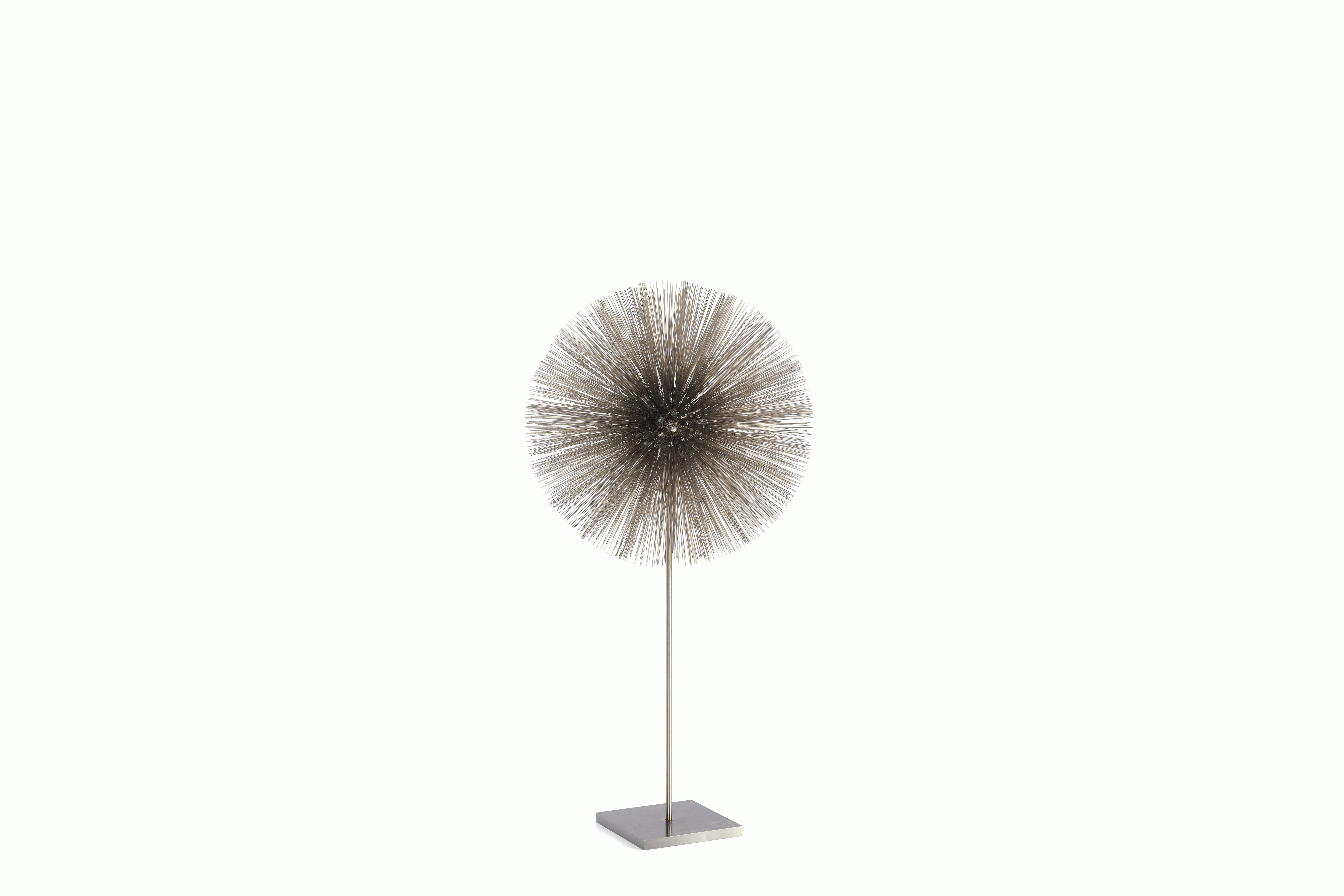 A Bertoia Dandelion sculpture in Stainless Steel viewed from an angle.