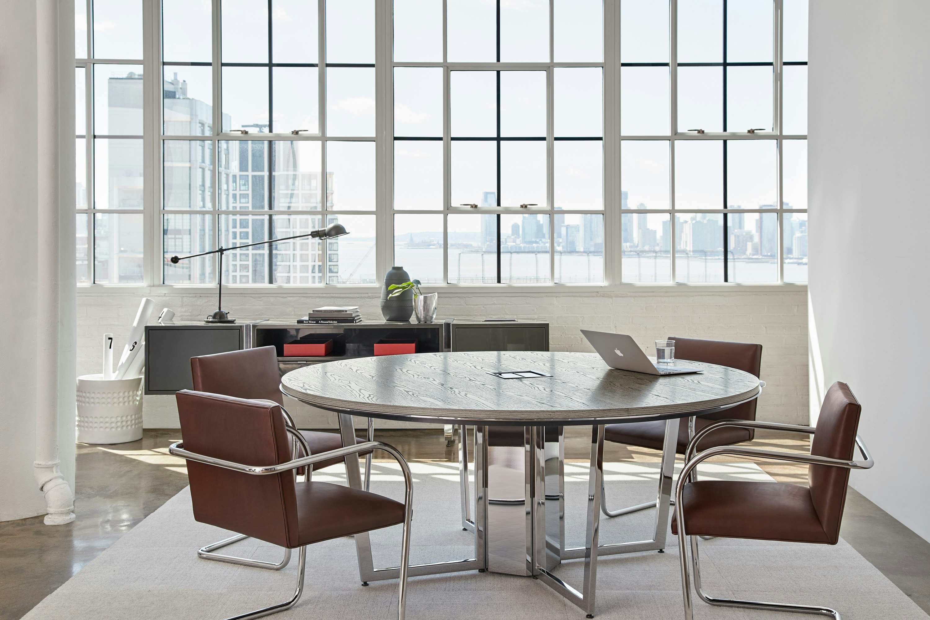 Highline Round Meeting Table in a Meeting Room setting with credenza in background.