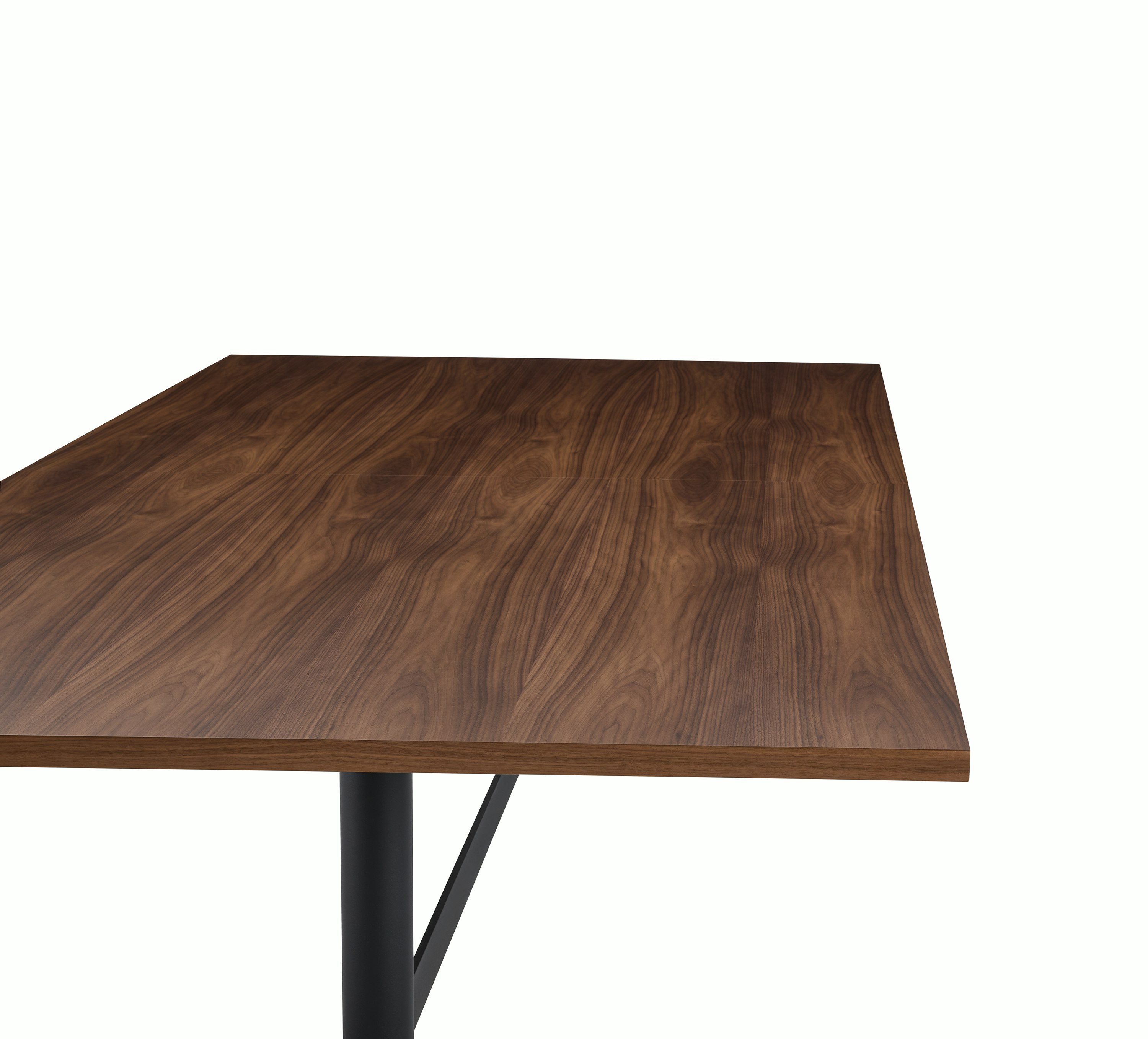 MP Table designed by Amir Paknya for Geiger in Natural Flat Cut Walnut shown on a white sweep, detail view of table edge.