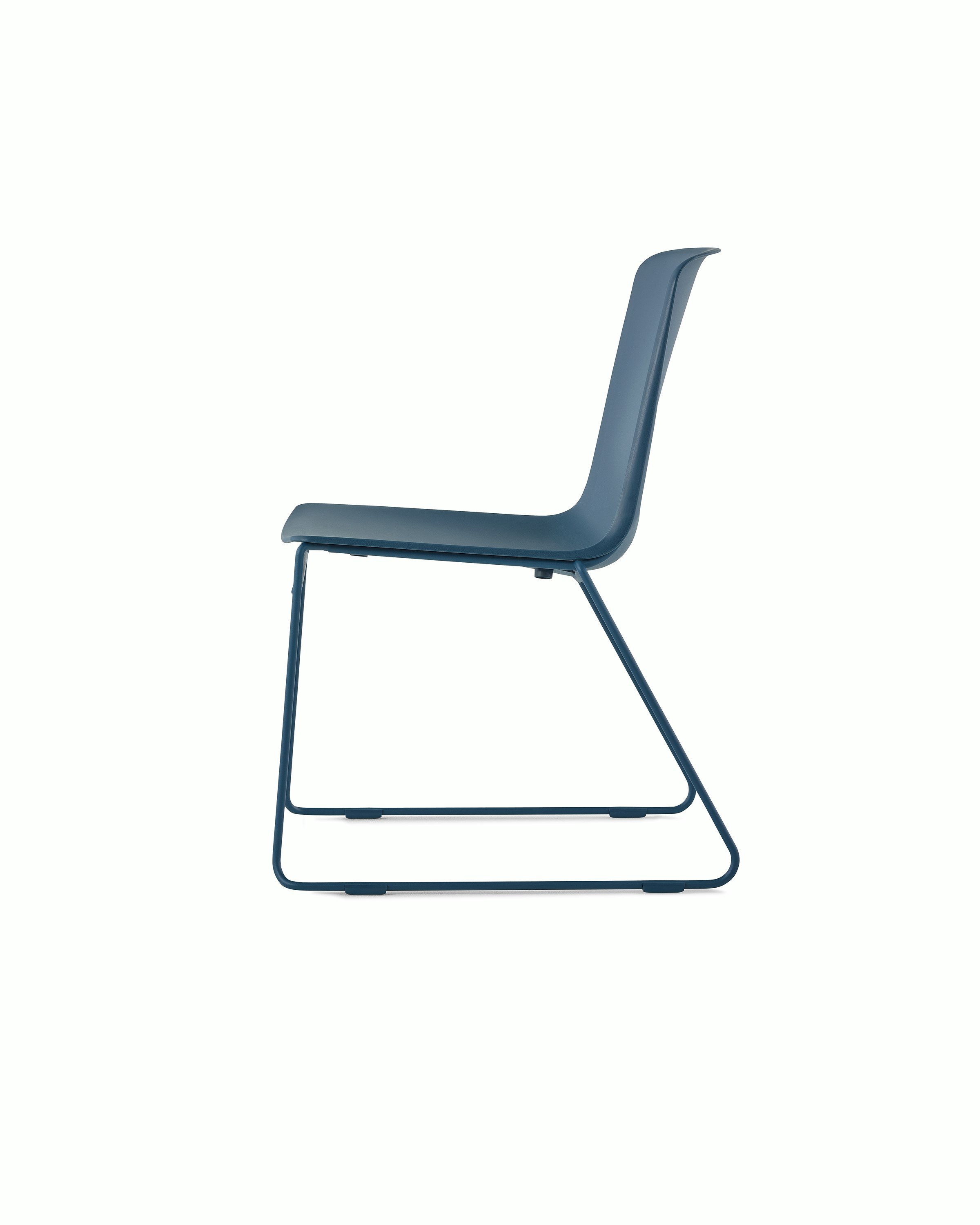 A peacock blue Pronta Stacking Chair with a dipped-in-color shell and base.