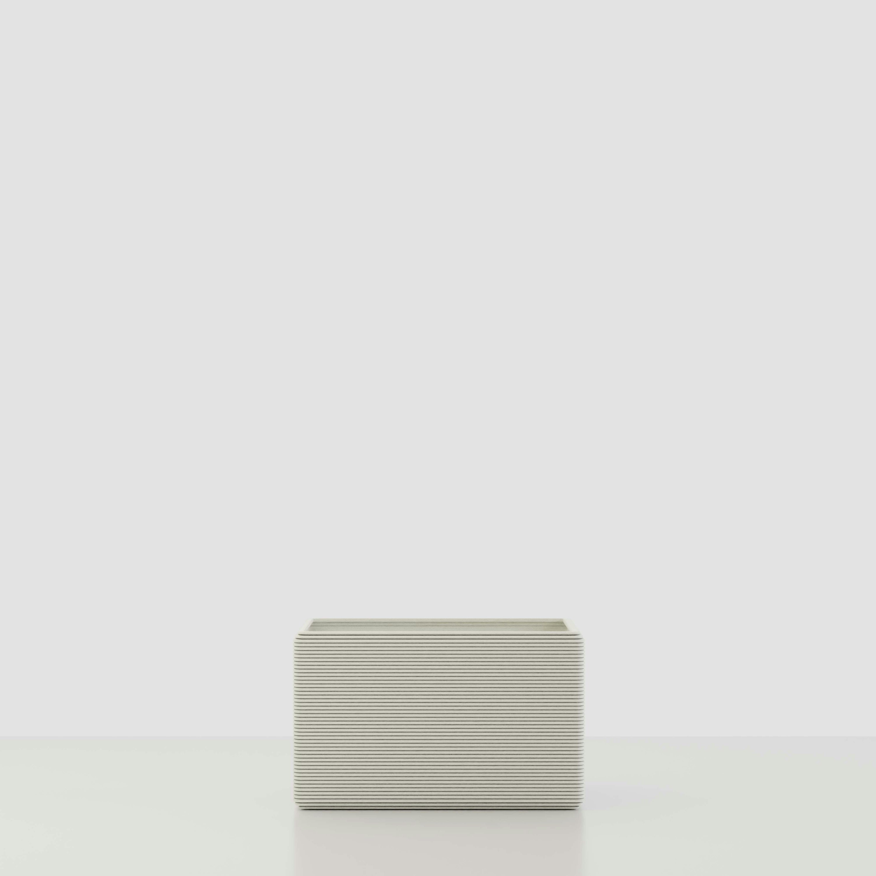 A Avila 3D Printed Concrete Planter in Glacial Mist Viewed from the front.