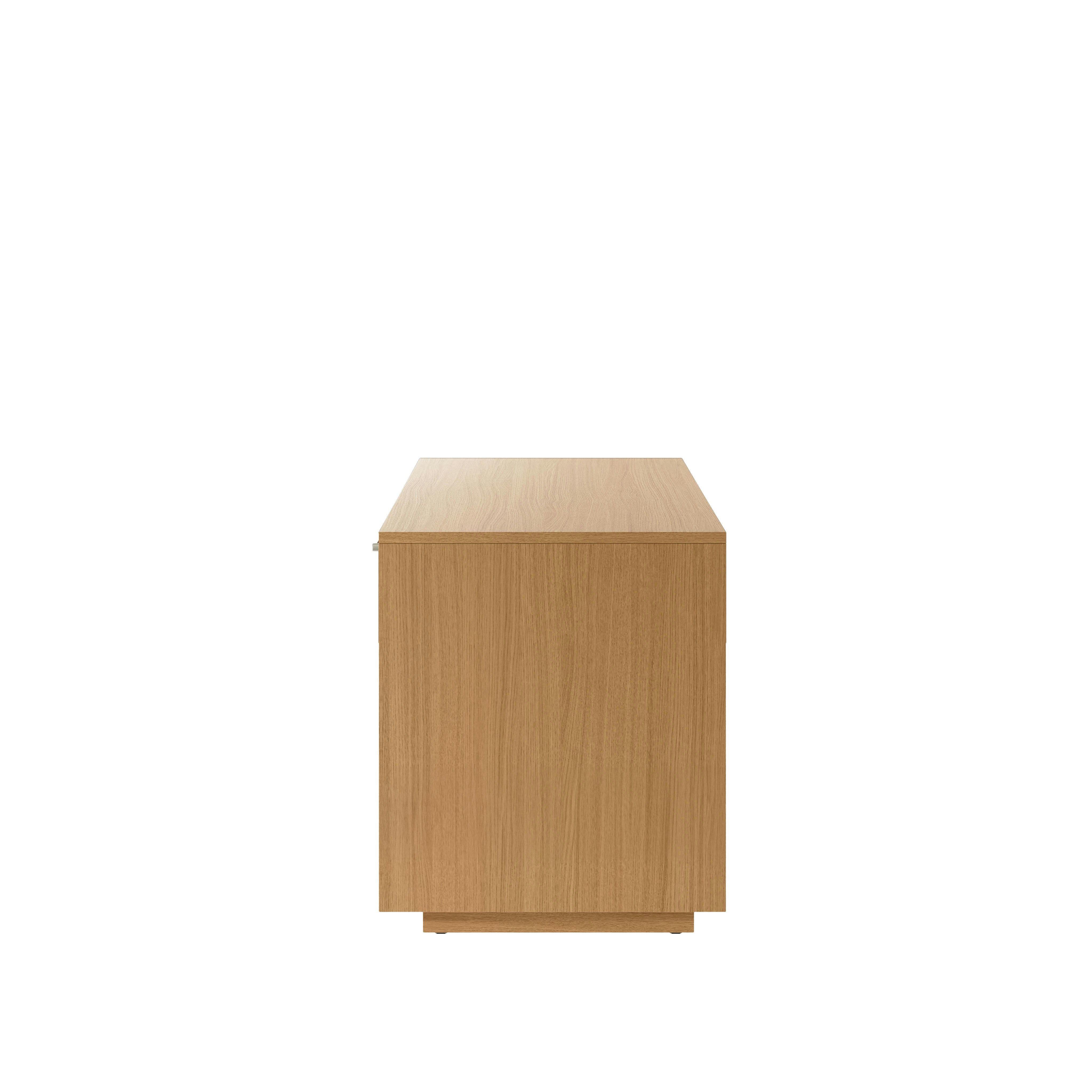 JD Credenza in Natural Rift Cut Oak with Satin Nickel drawer pulls viewed from the side.