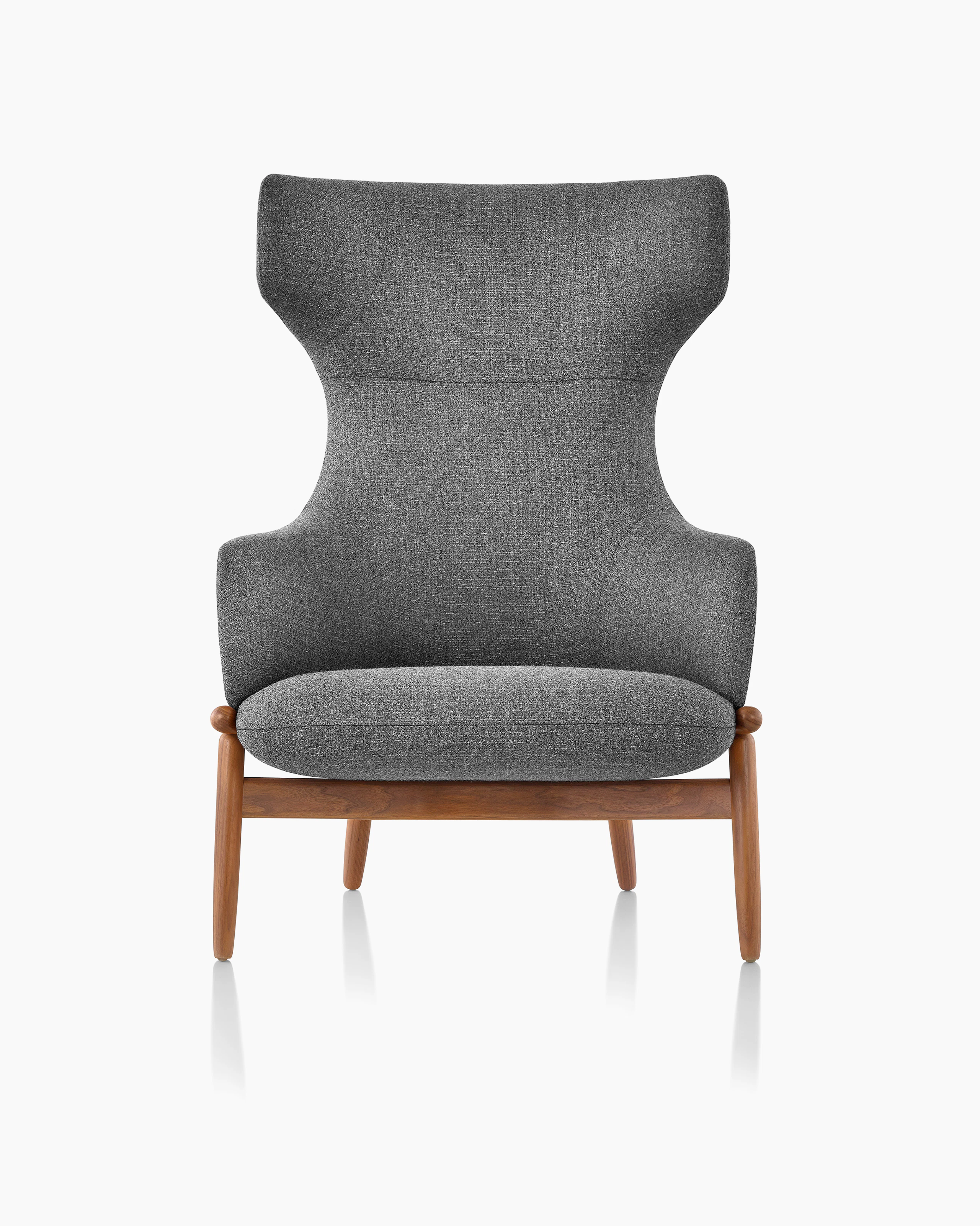 A wing-back Reframe Lounge Chair in Milaner Charcoal, viewed from the front.
