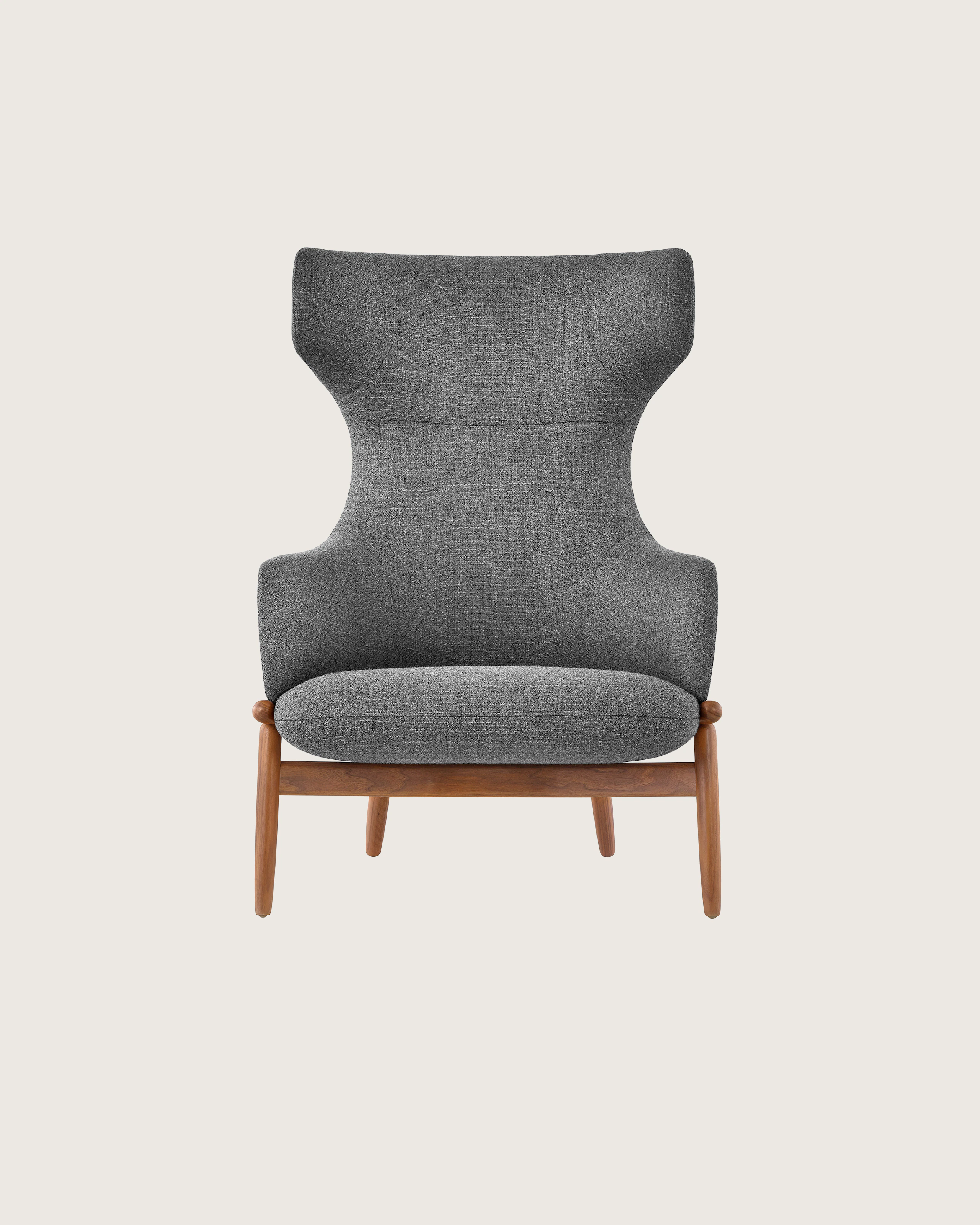 A wing-back Reframe Lounge Chair in Milaner Charcoal, viewed from the front.