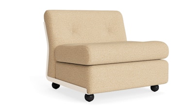 A front three quarter view of cream colored Amanta Sofa from HAY