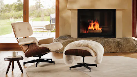 Eames Lounge and Ottoman in Cream boucle in frnot a fireplace