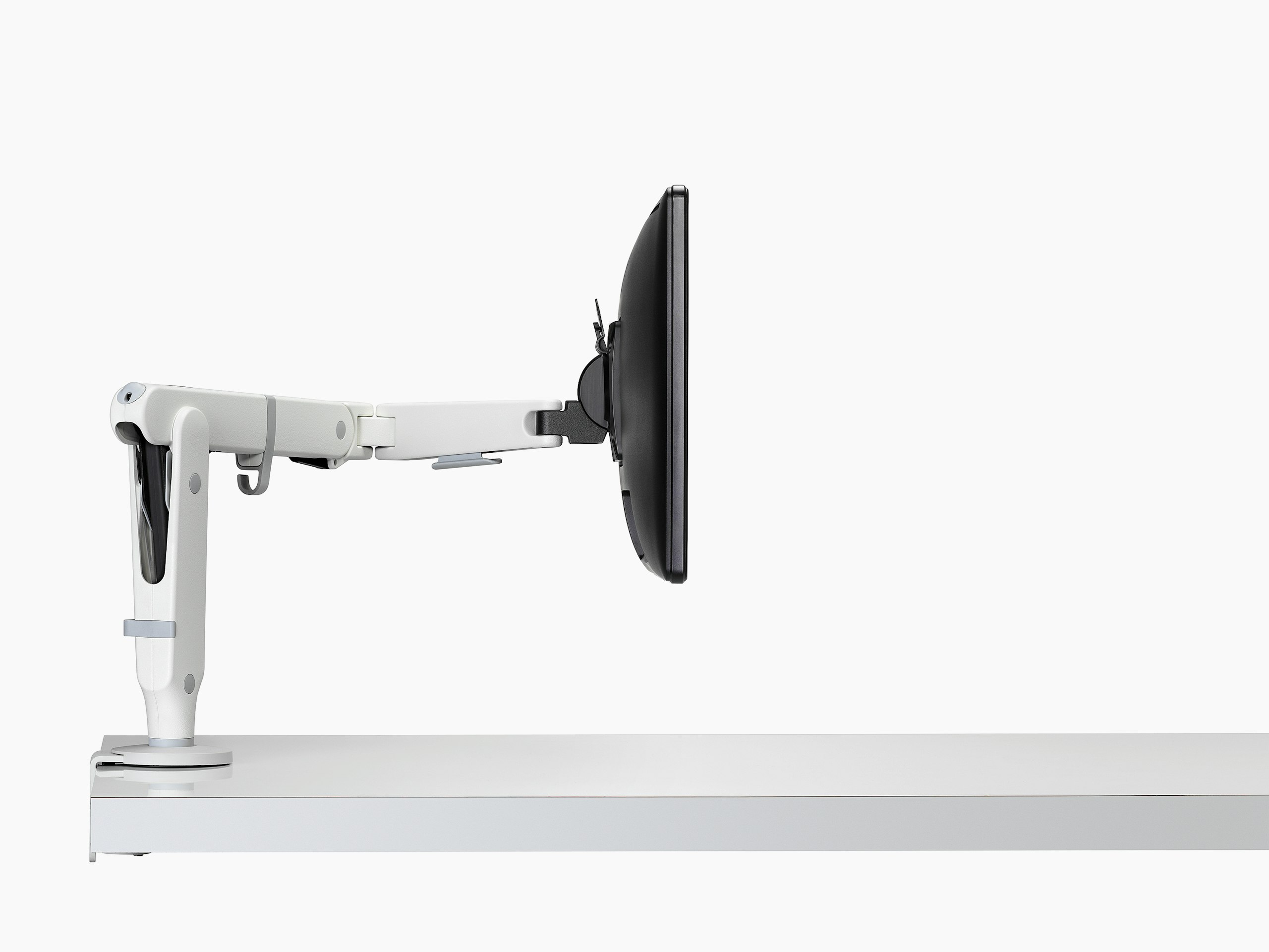 Ollin single monitor arm white viewed from the side.