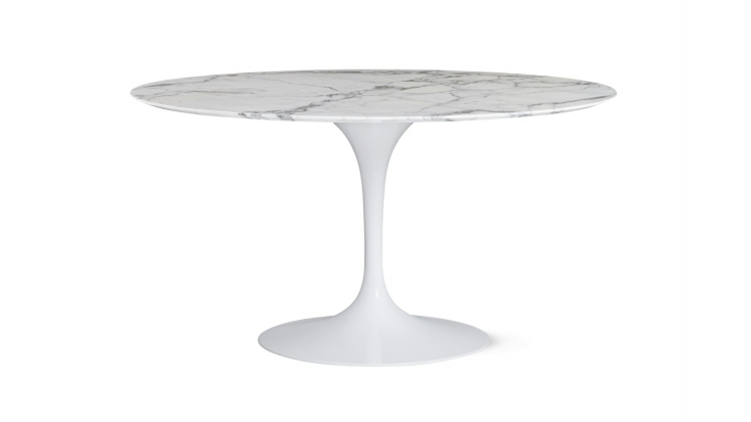 A white Saarinen Dining Table by Knoll