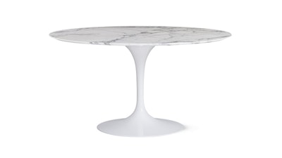 A white Saarinen Dining Table by Knoll