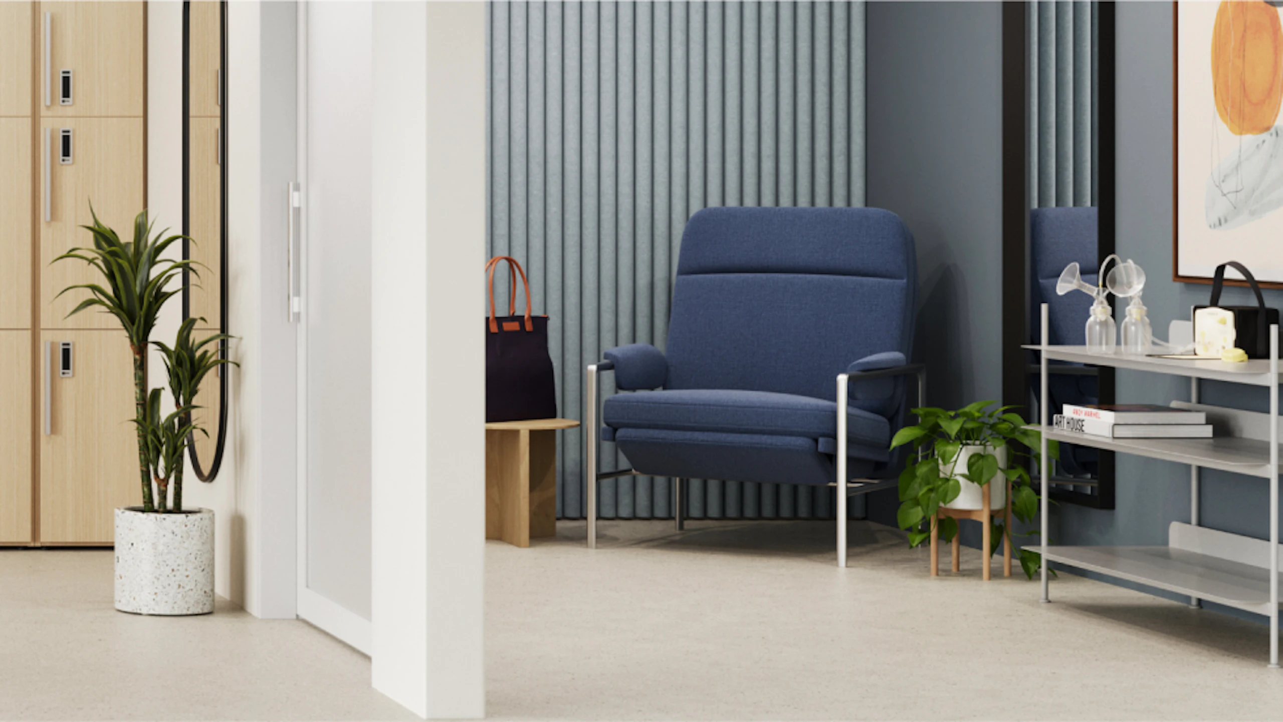 Quiet area with a comfortable blue armchair, small side table with a handbag, and a plant. Slatted wall paneling and a mirror add texture to the space. Lockers visible on the left.