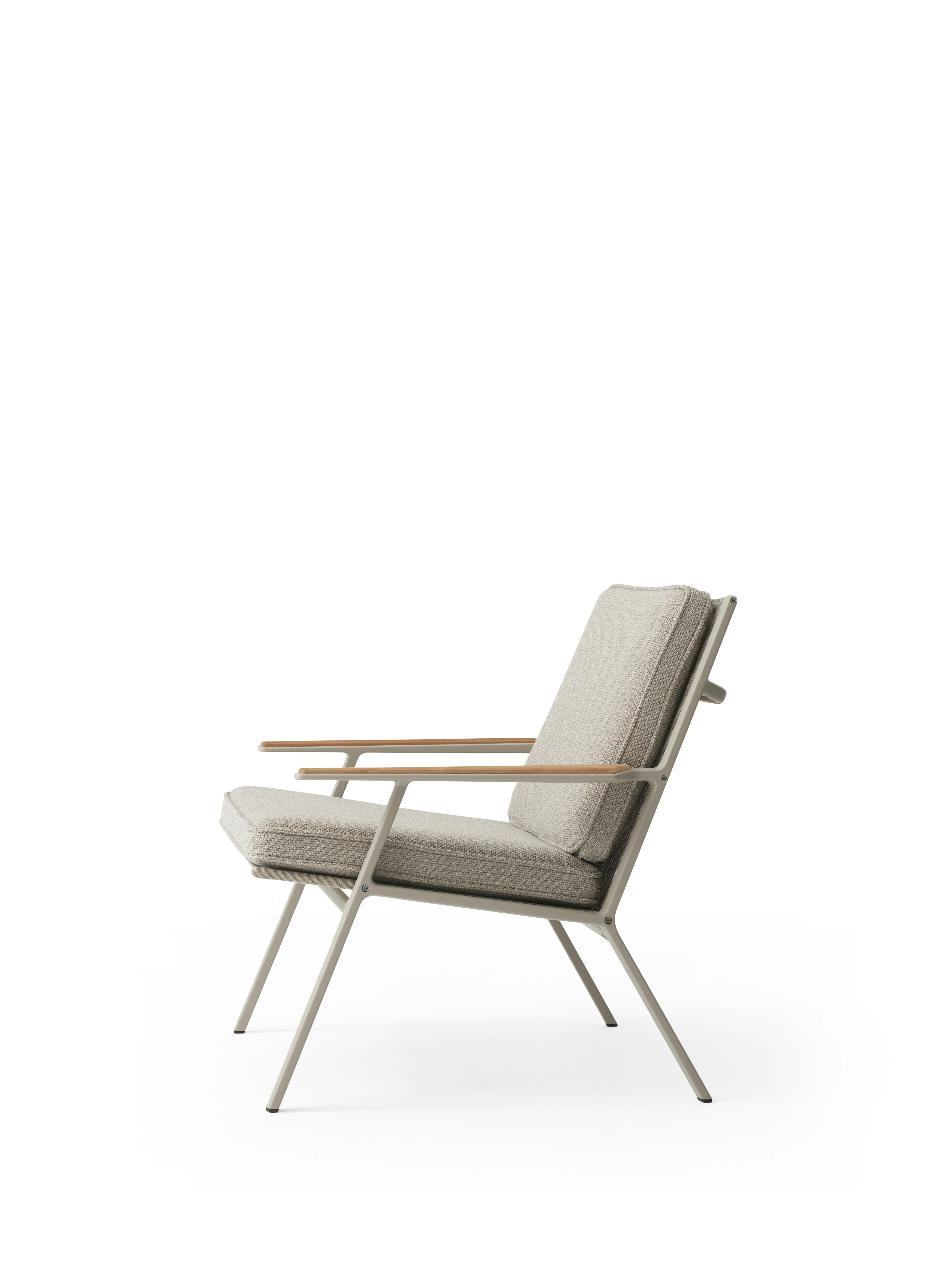 A Vipp713 Open-Air Lounge Chair Viewed from an angle.