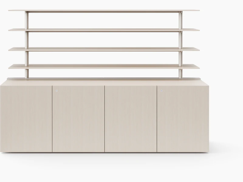 A credenza with closed doors is covered in a light veneer and has open shelving attached to the top of the credenza.