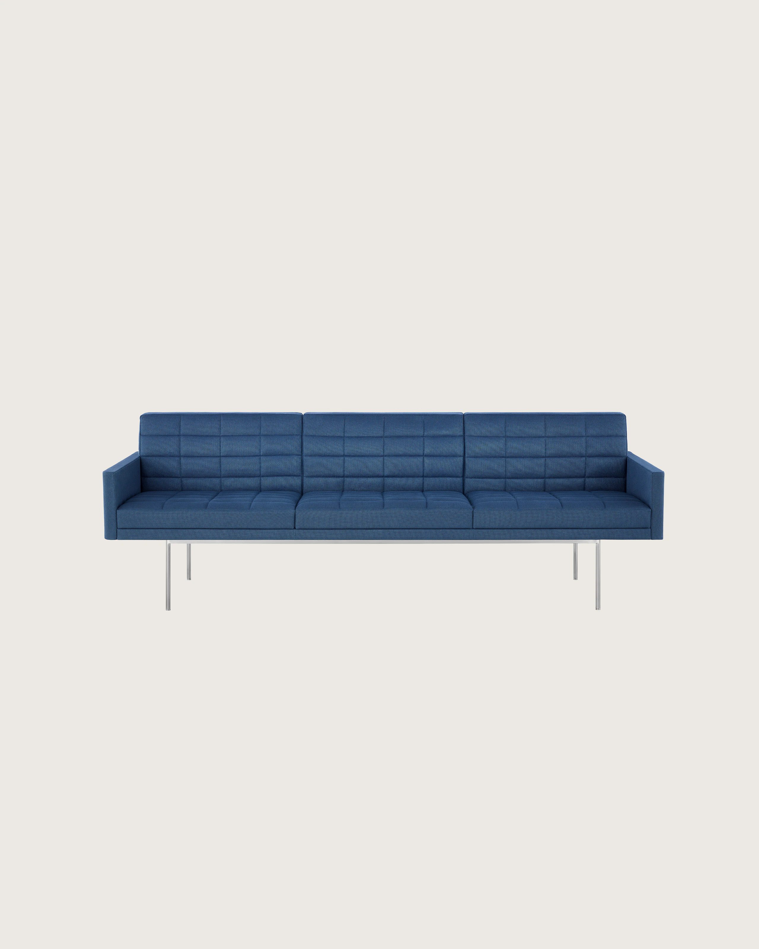 Front view of a quilted Tuxedo Component sofa upholstered in blue fabric.