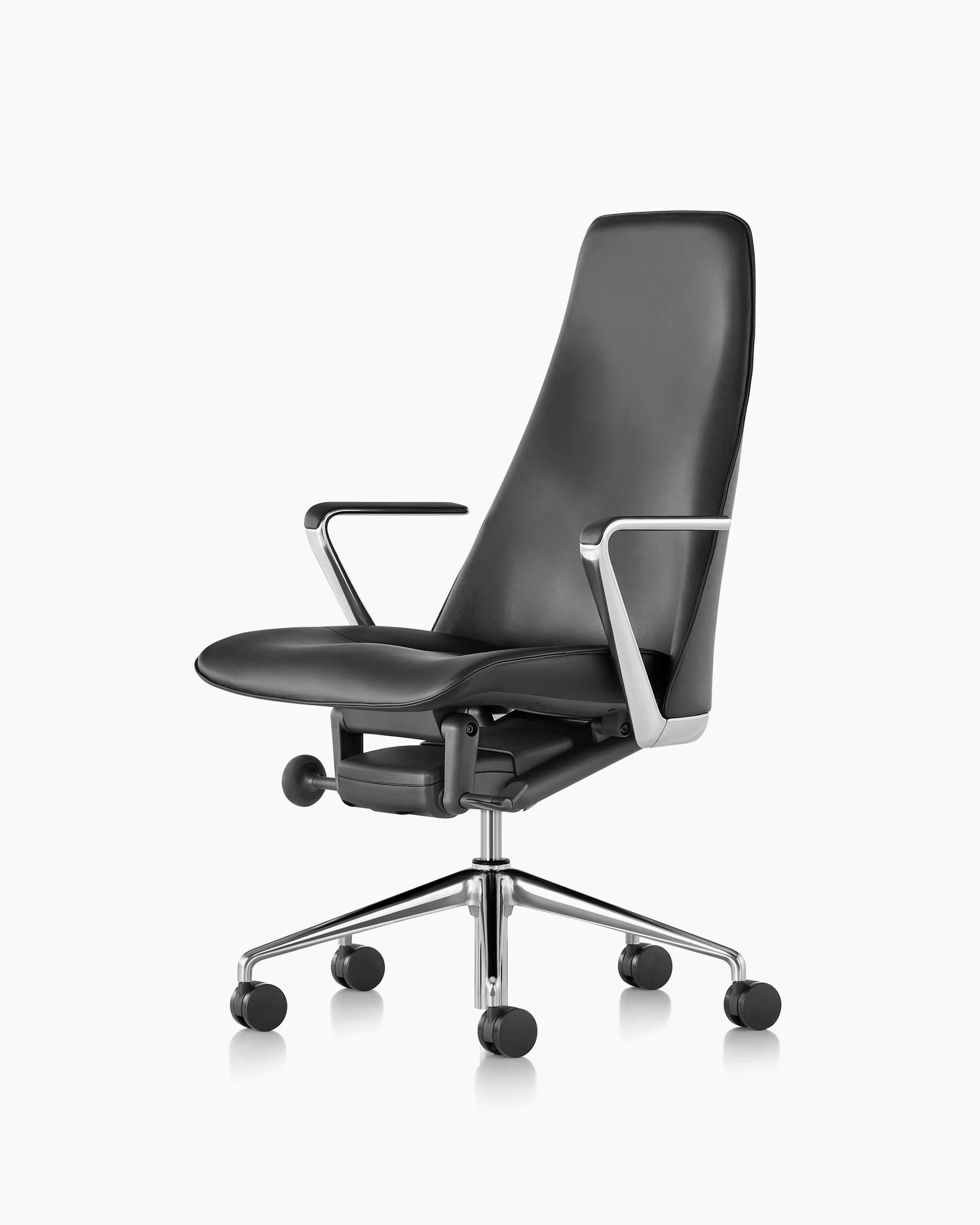 Angled view of a Taper office chair with black leather upholstery.