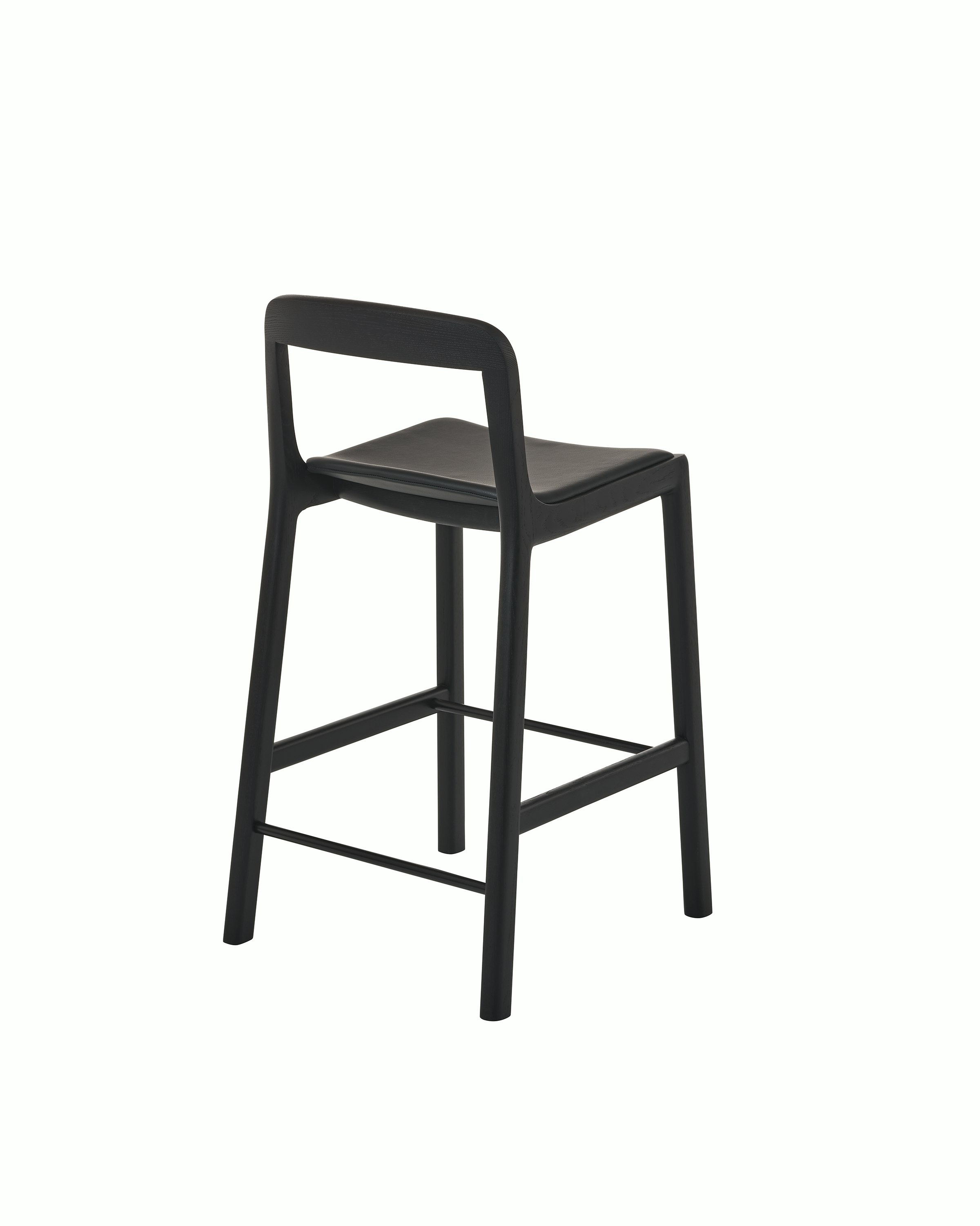 Lijn Stool by Carole Baijings for Geiger in Ebonized Oak frame upholstered with Maharam Prone Leather in Obsidian, angled back view on a white sweep.