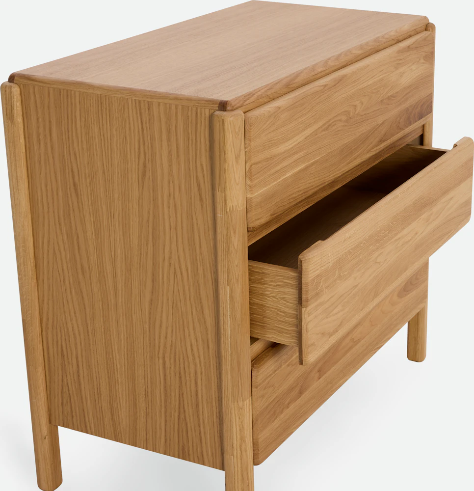 Wood dresser with three drawers pulled open
