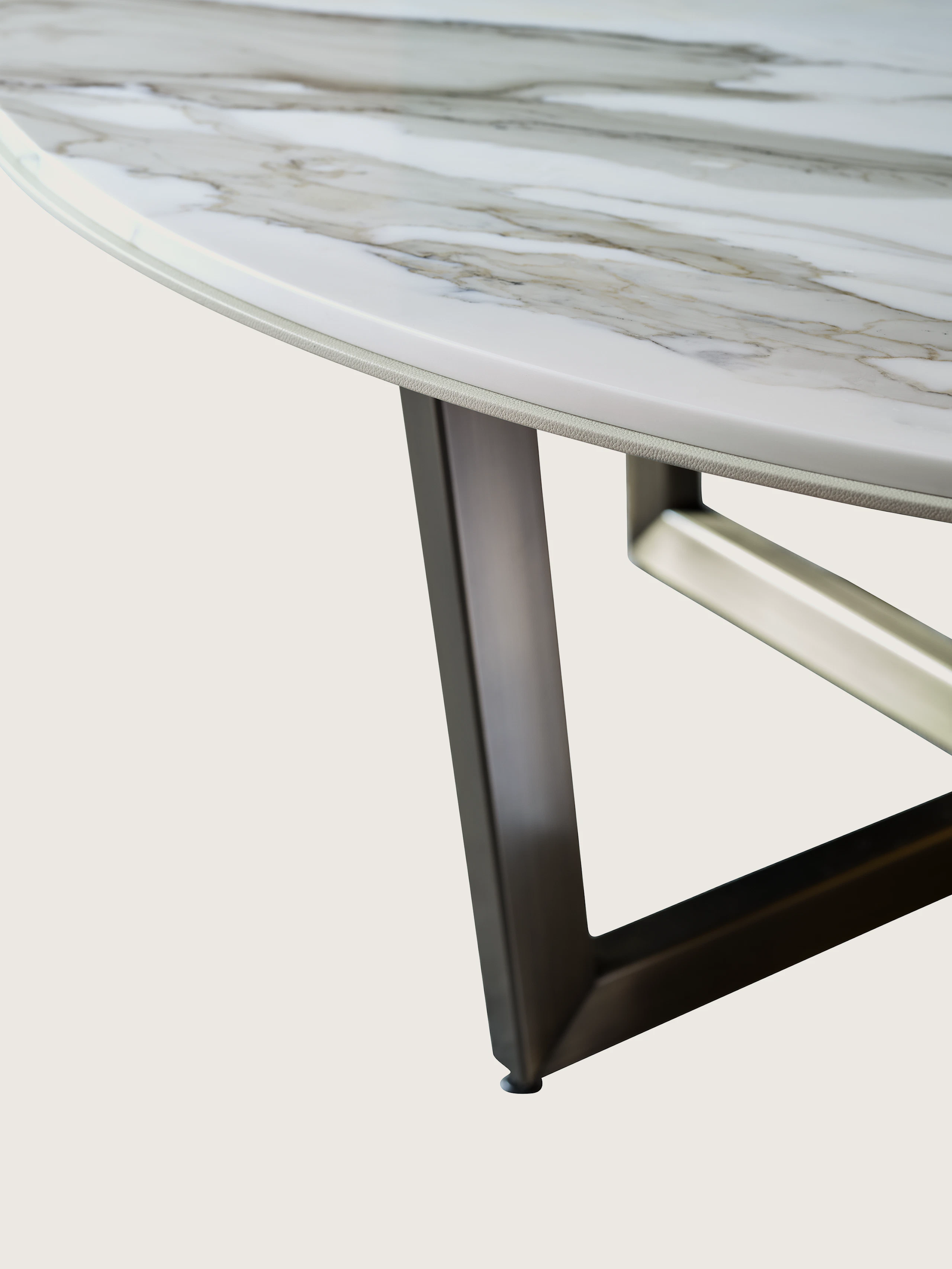 Highline Meeting Table with custom Calacatta Gold round top, Satin Nickel metal trim, detail view.