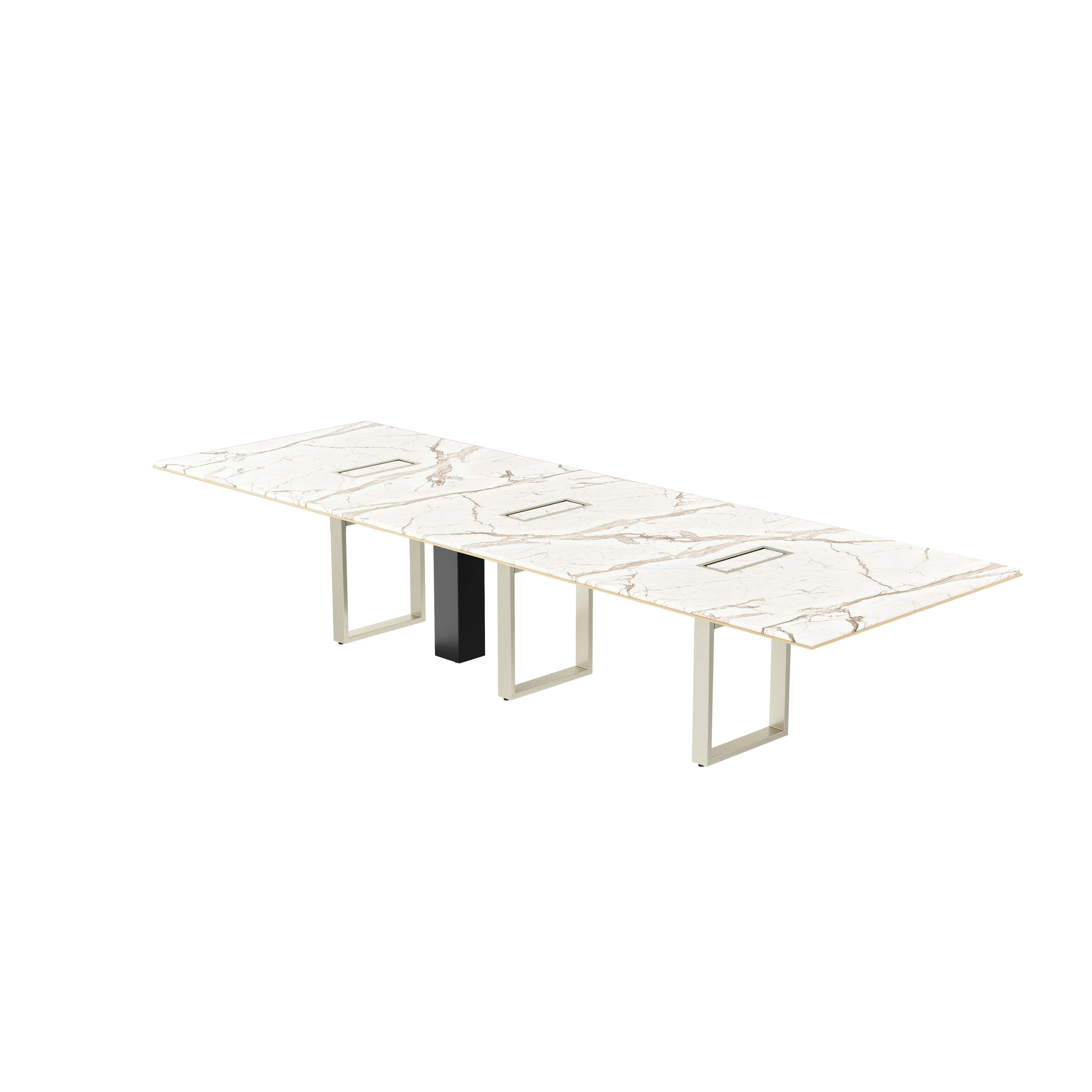 Highline Conference Table in Calacatta Gold Stone with leather edge detail and Satin Nickel base viewed from a 45 degree angle.