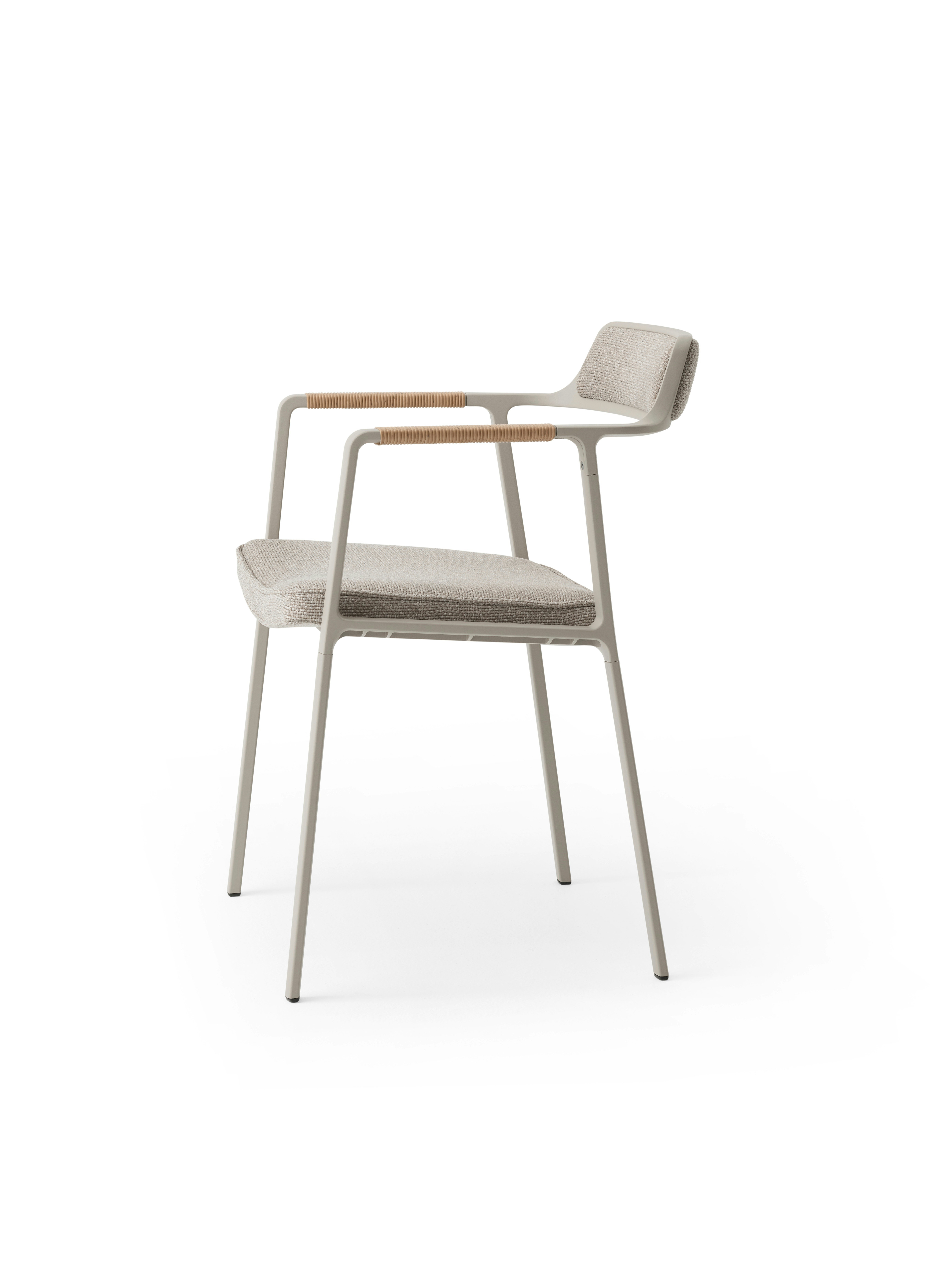 A Vipp711 Open-Air Chair Viewed from the side.