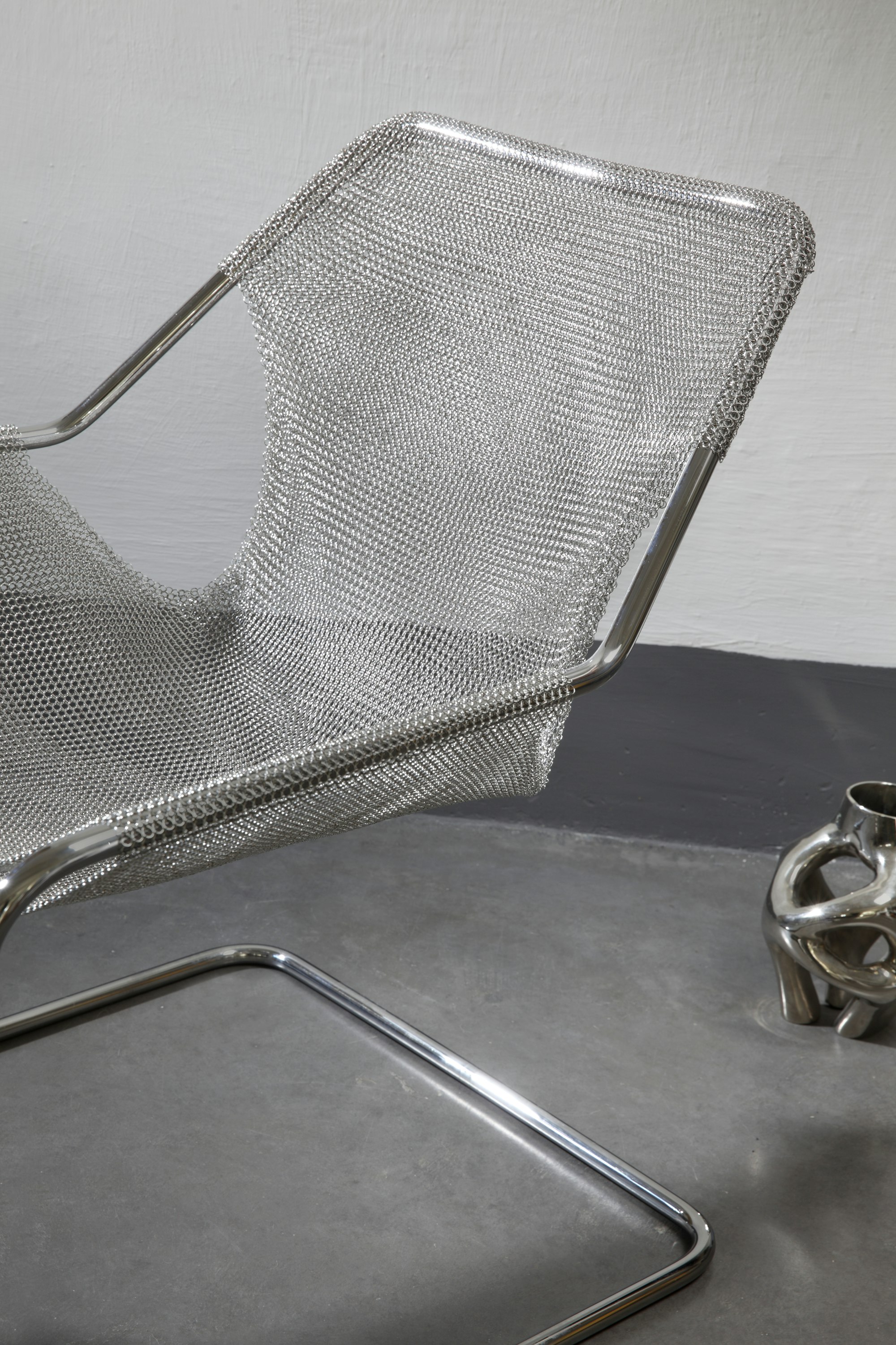 Environmental shot of Paulistano Armchair in Silver Mesh, Stainless Steel.