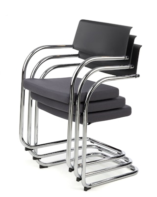 Knoll black Moment Side Chairs stacked