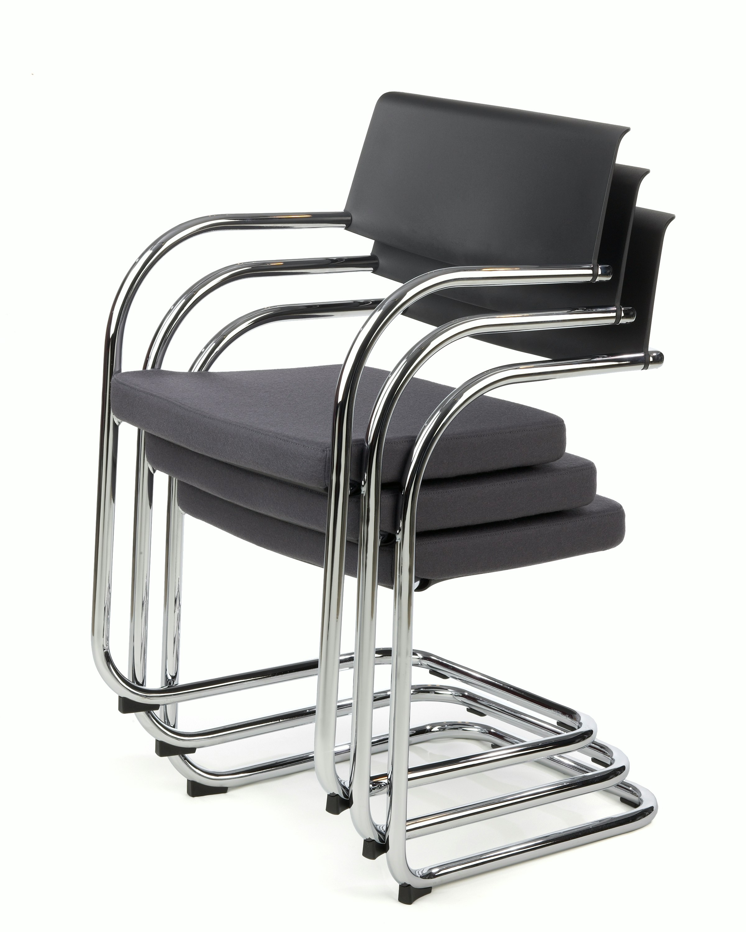 Knoll black Moment Side Chairs stacked