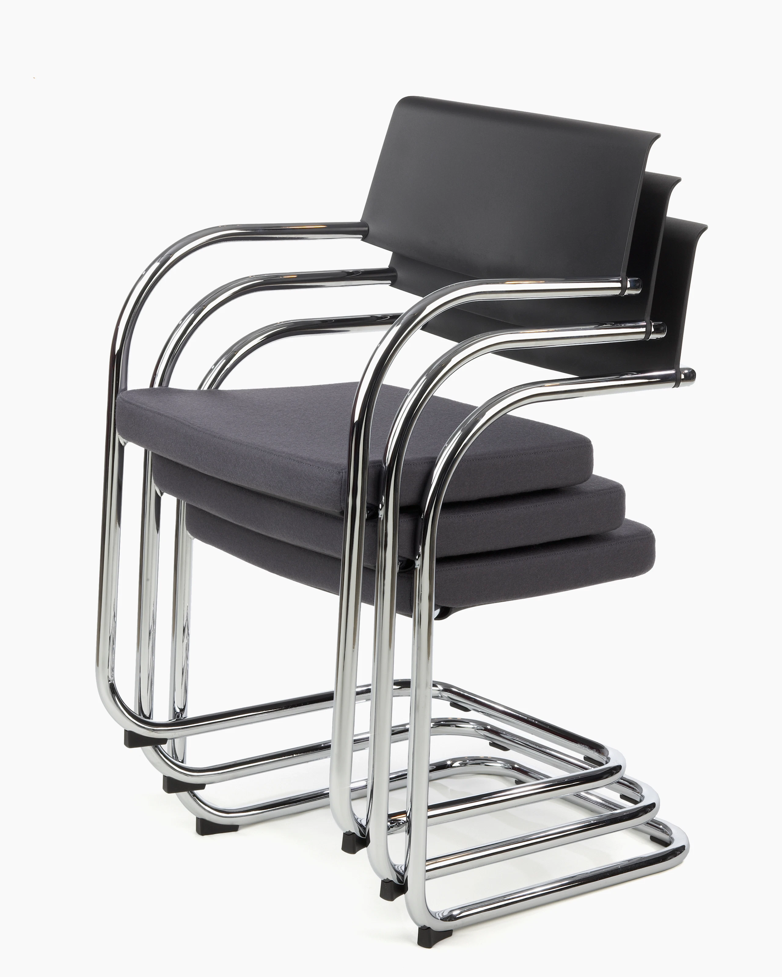 Knoll black Moment Side Chairs stacked