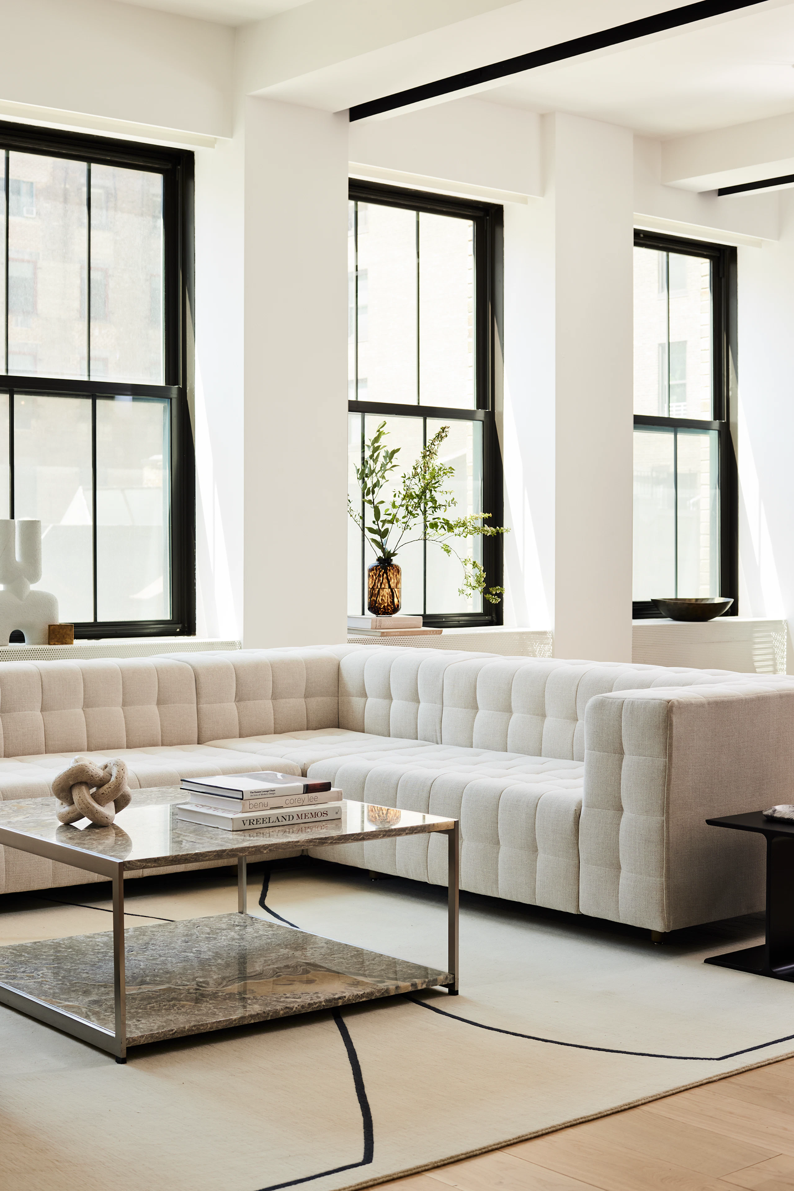 A contract lounge seating area with Rapport Sofa and H Frame Coffee Table.