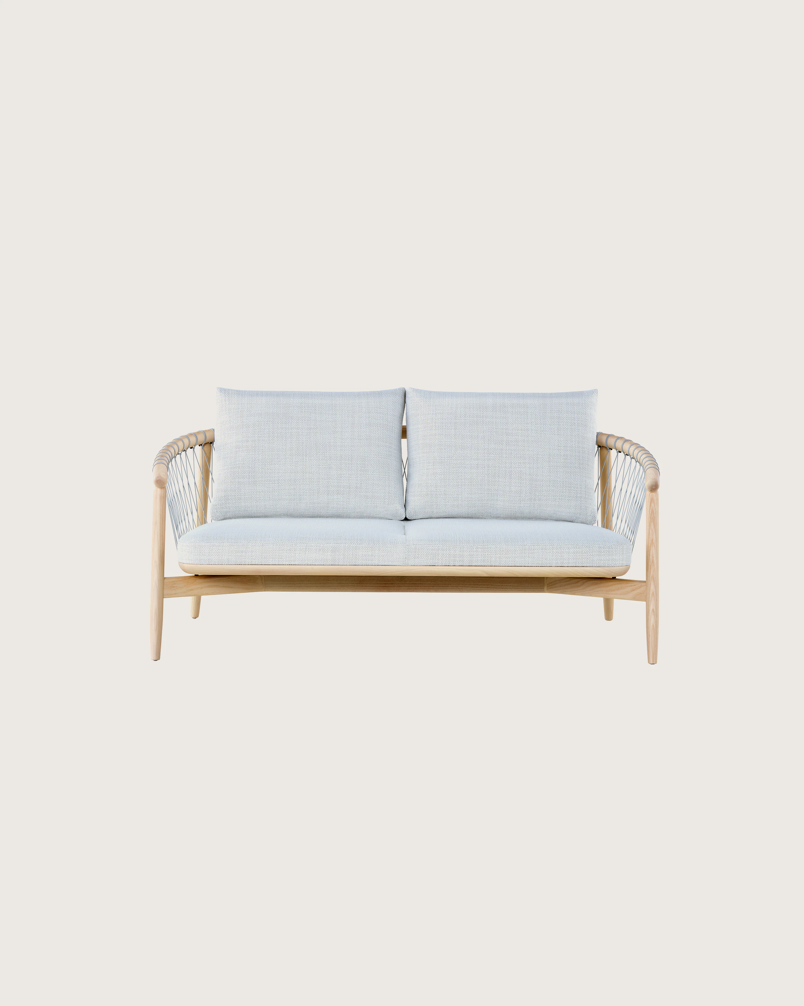 A light-colored Crosshatch Settee featuring gray upholstery and a white ash frame. Viewed from the front.