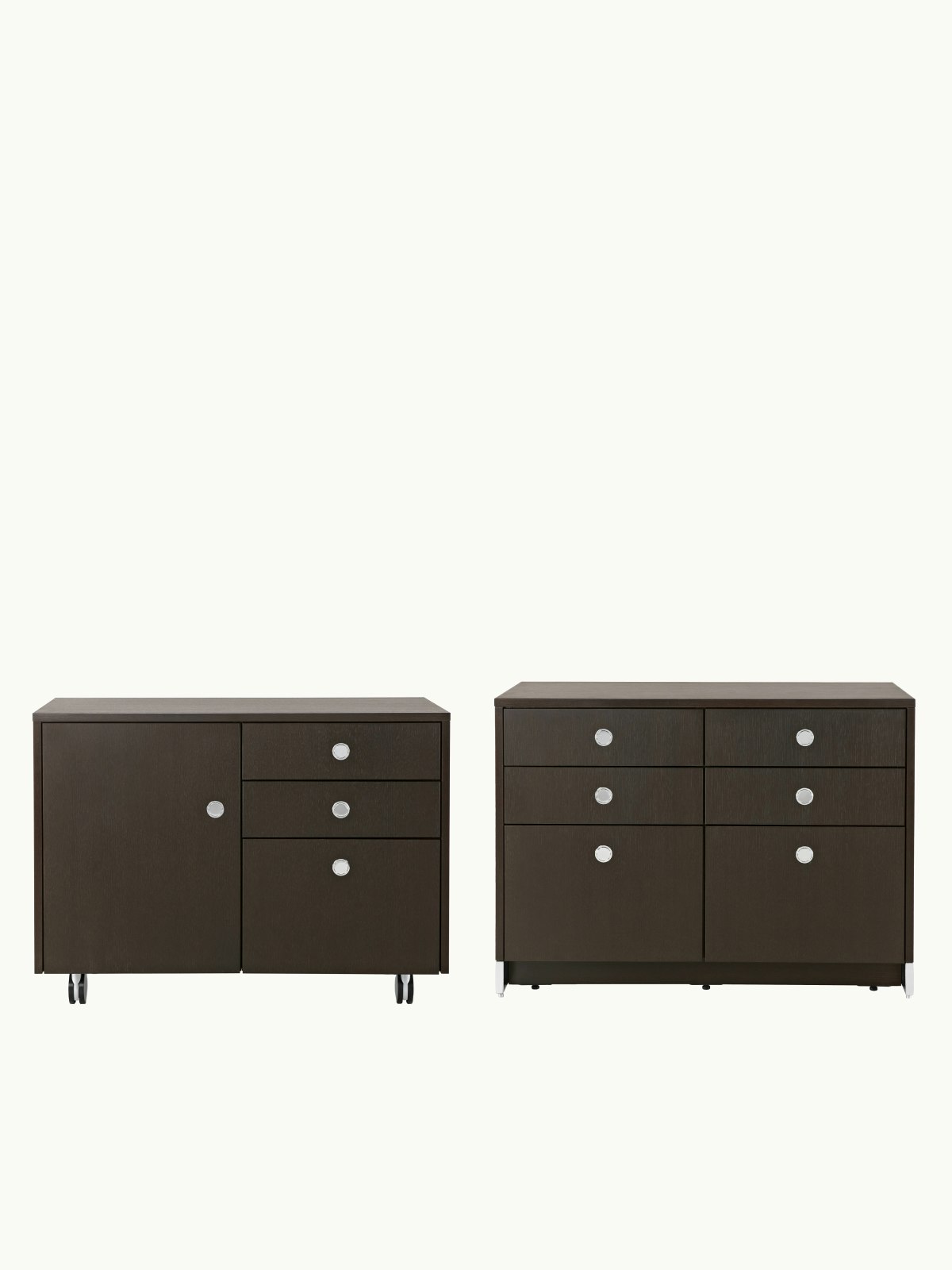 Two Sled Base Storage units designed by Ward Bennett, one pedestal unit with casters front-facing, one credenza with casters viewed at an angle, on a white sweep.