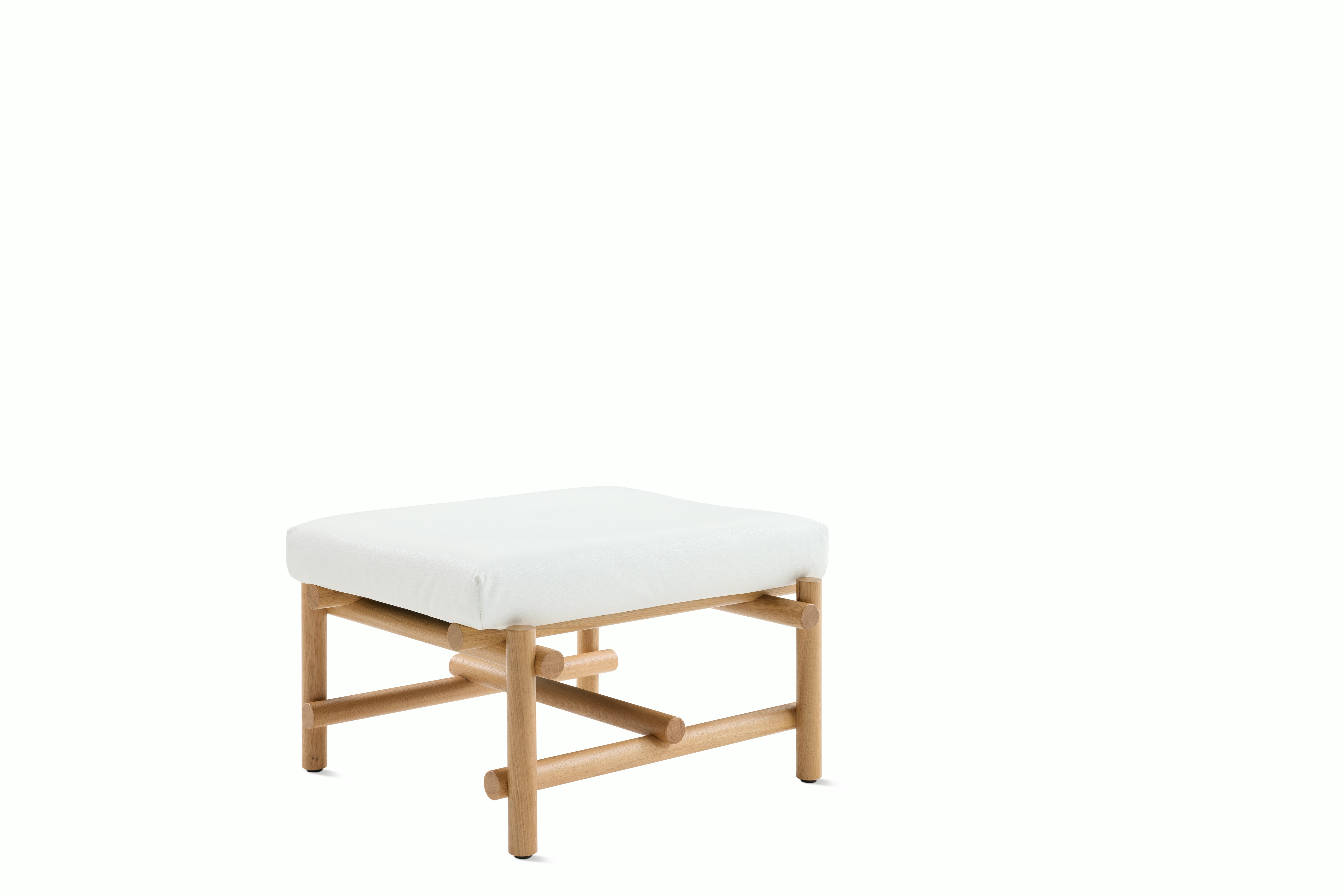 A Muecke Ottoman in White White Oak viewed from an angle.