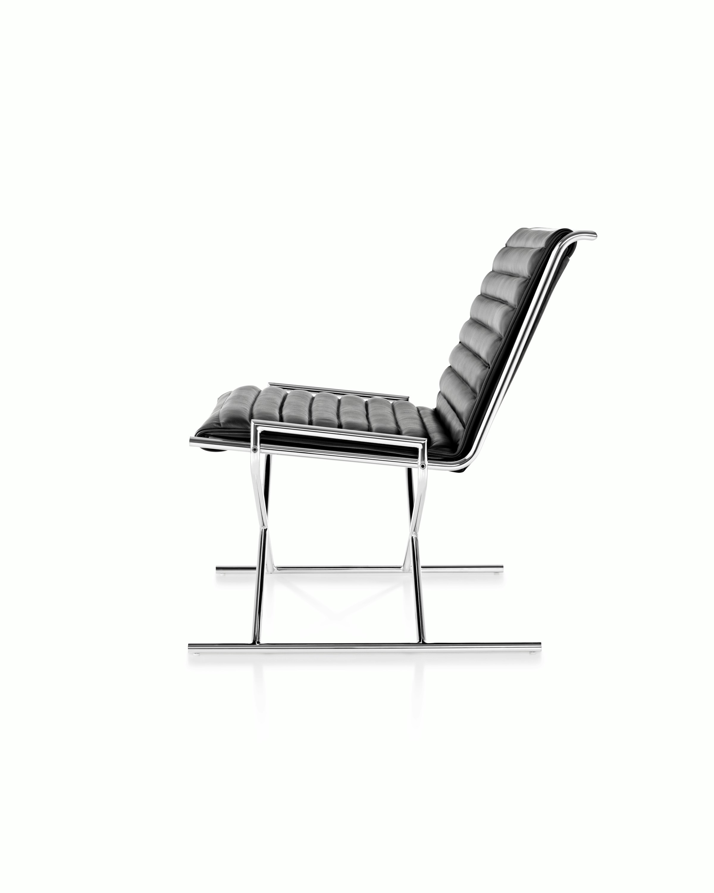 Side view of a Sled lounge chair with ribbed black leather upholstery.