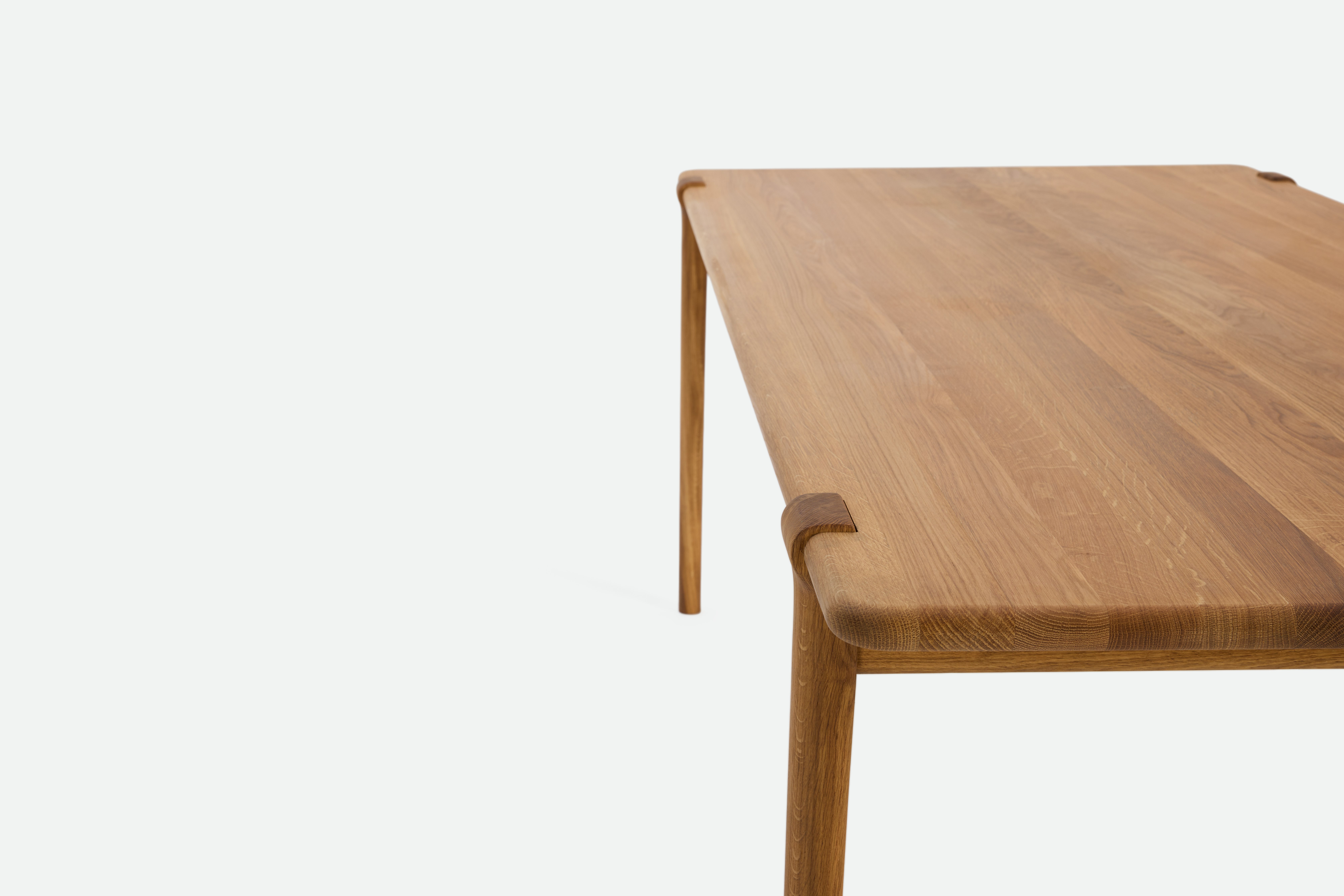 A detailed look at an Otto Dining Table in Oak.