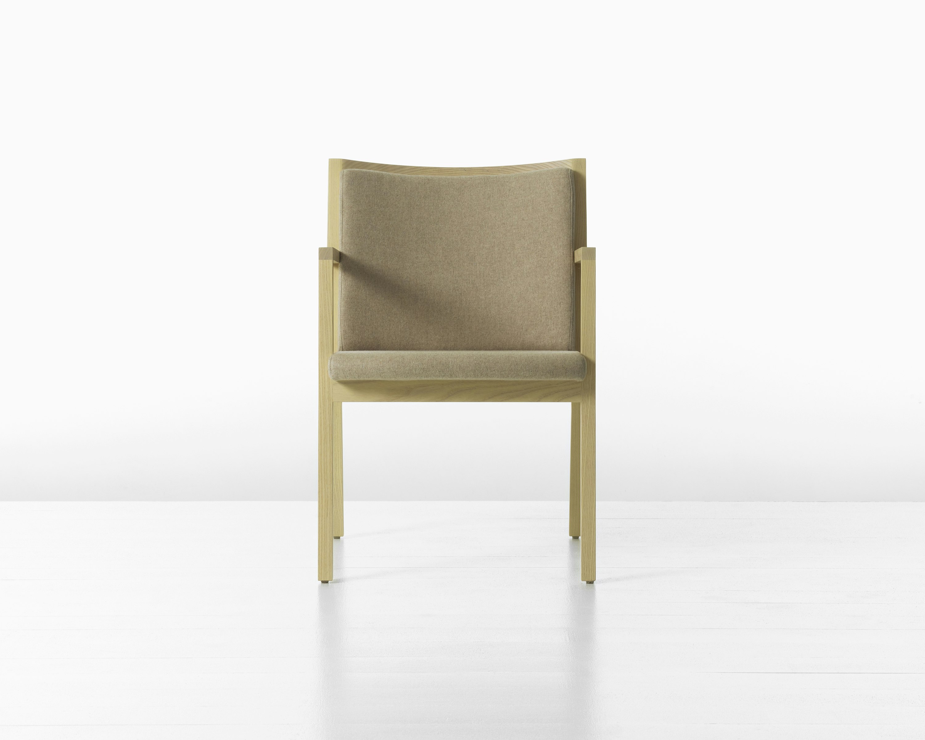 A Ascribe Chair upholstered in Clare Bluff textile, viewed from the front.