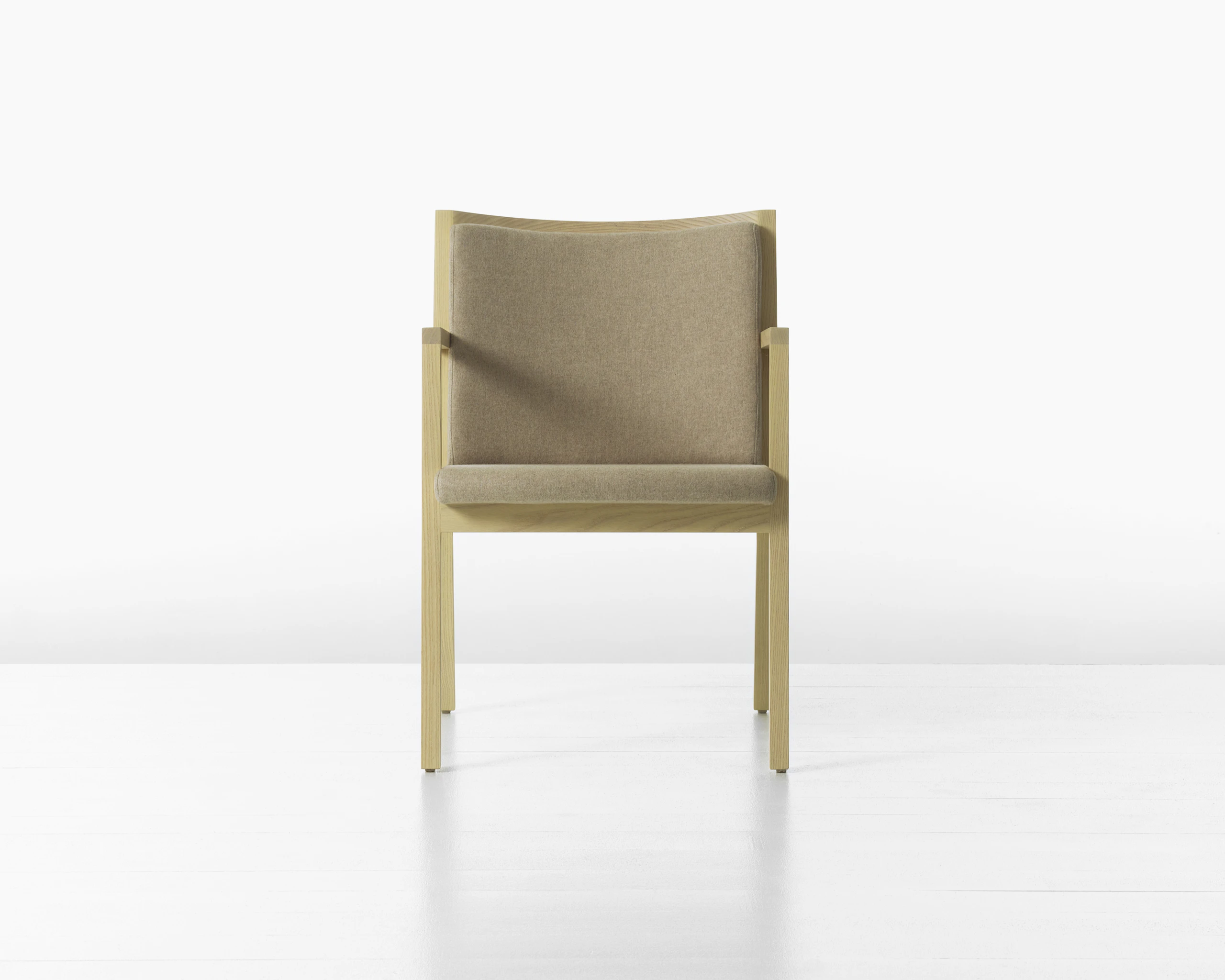 A Ascribe Chair upholstered in Clare Bluff textile, viewed from the front.