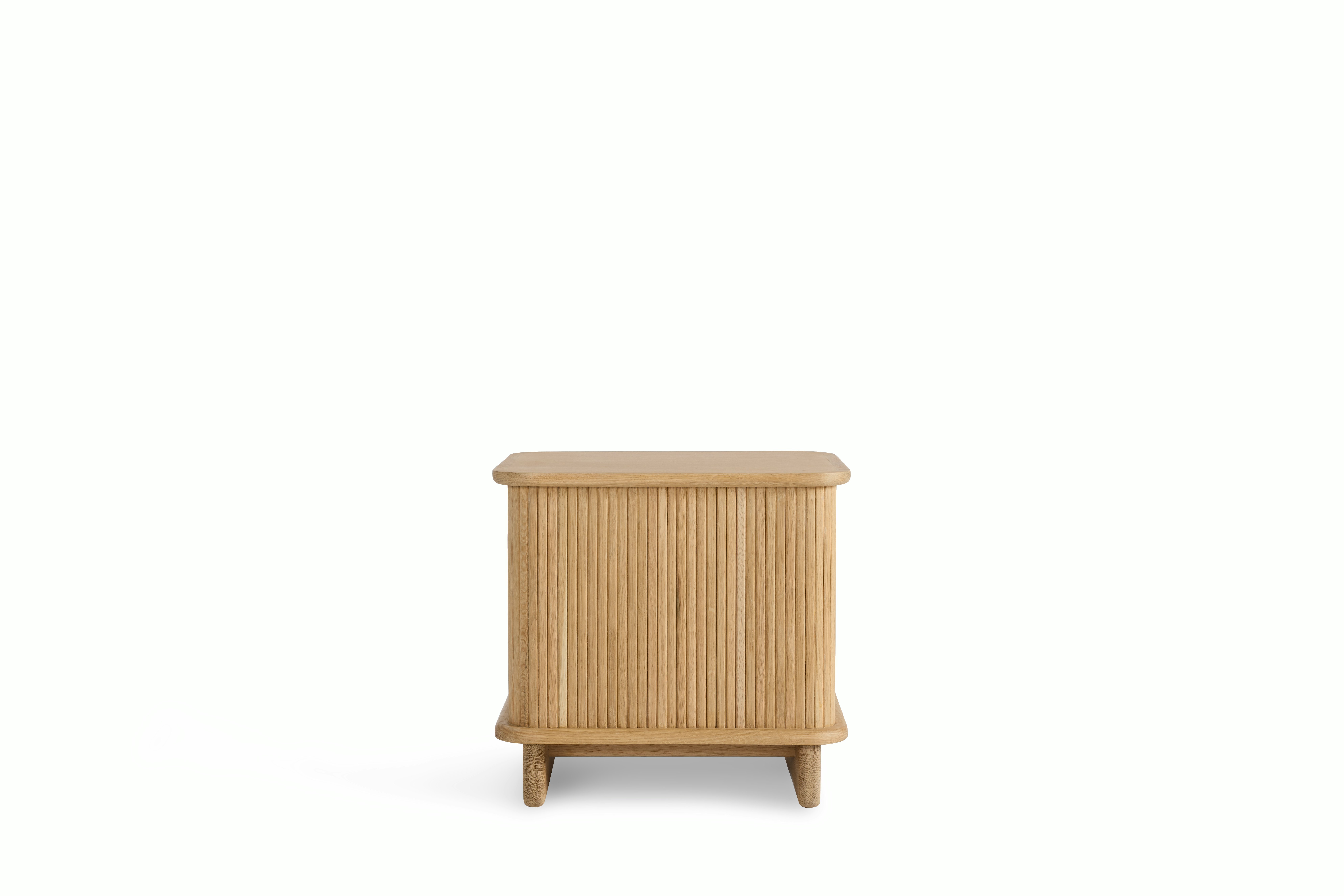 A Noviembre Bedside Table in Oak viewed from behind.