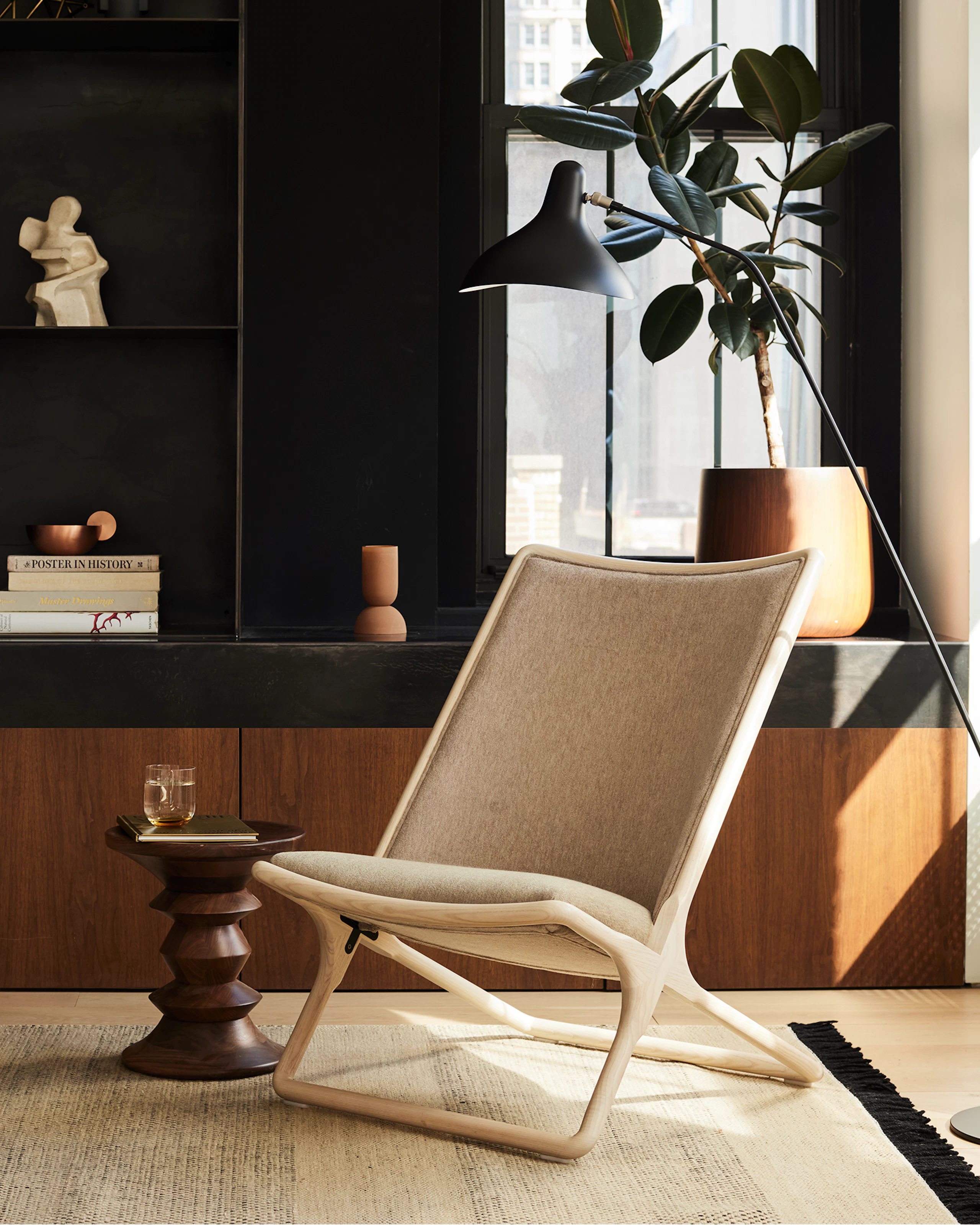 A lounge setting with two Scissor Chairs in a residential space.